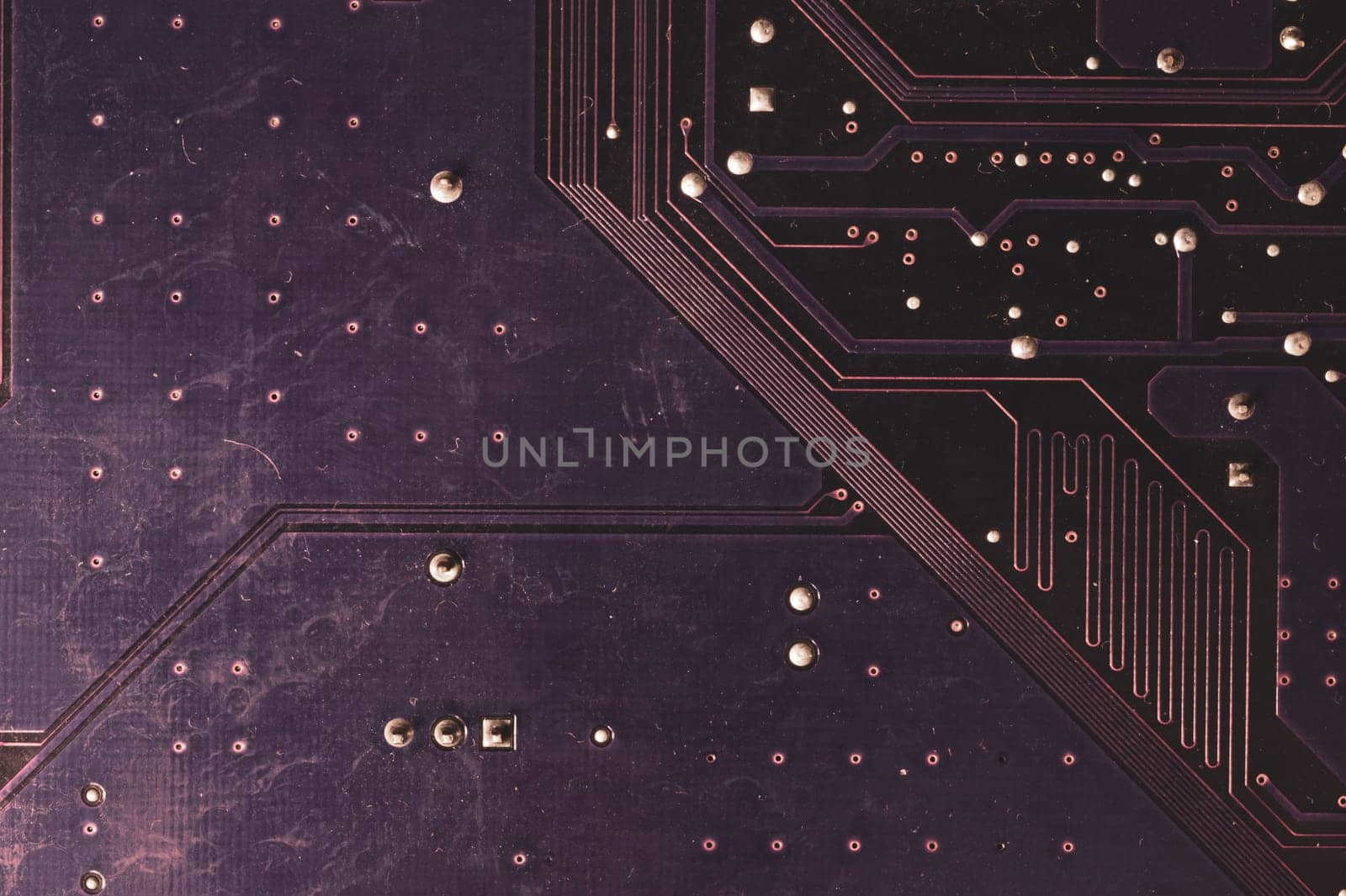 Spoiled motherboard close up. circuit board with dust and defects. modern technologies. micro elements of computer with connections and traces. Intelligent technology abstract background