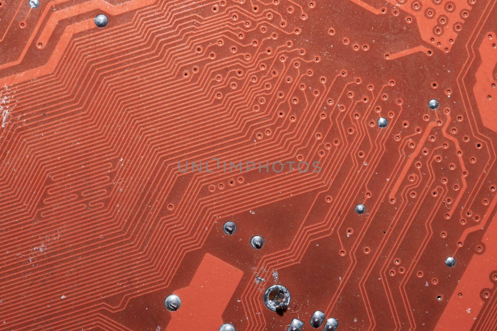 Spoiled motherboard close up. circuit board with dust and defects. modern technologies. micro elements of computer with connections and traces. Intelligent technology abstract background