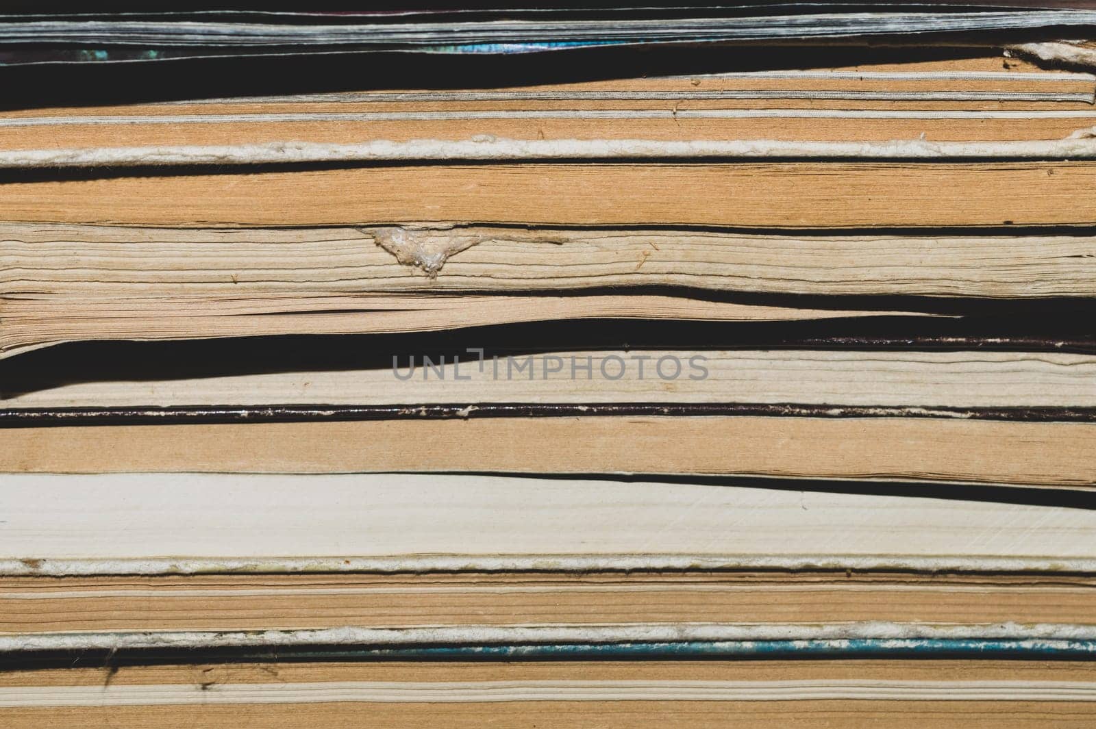 Stack of old books close up abstract background