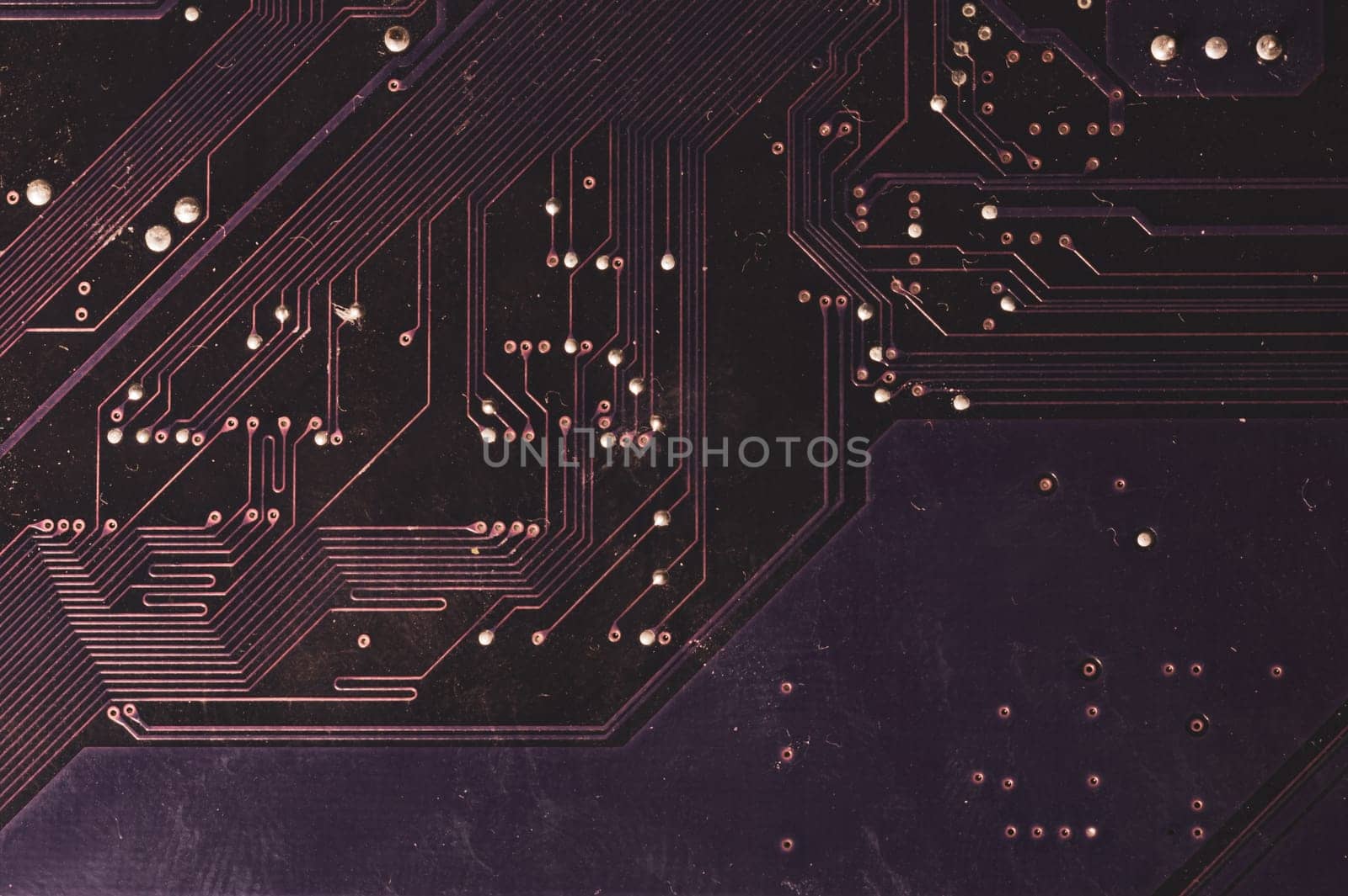 Spoiled motherboard close up. circuit board with dust and defects. modern technologies. micro elements of computer with connections and traces. Intelligent technology abstract background