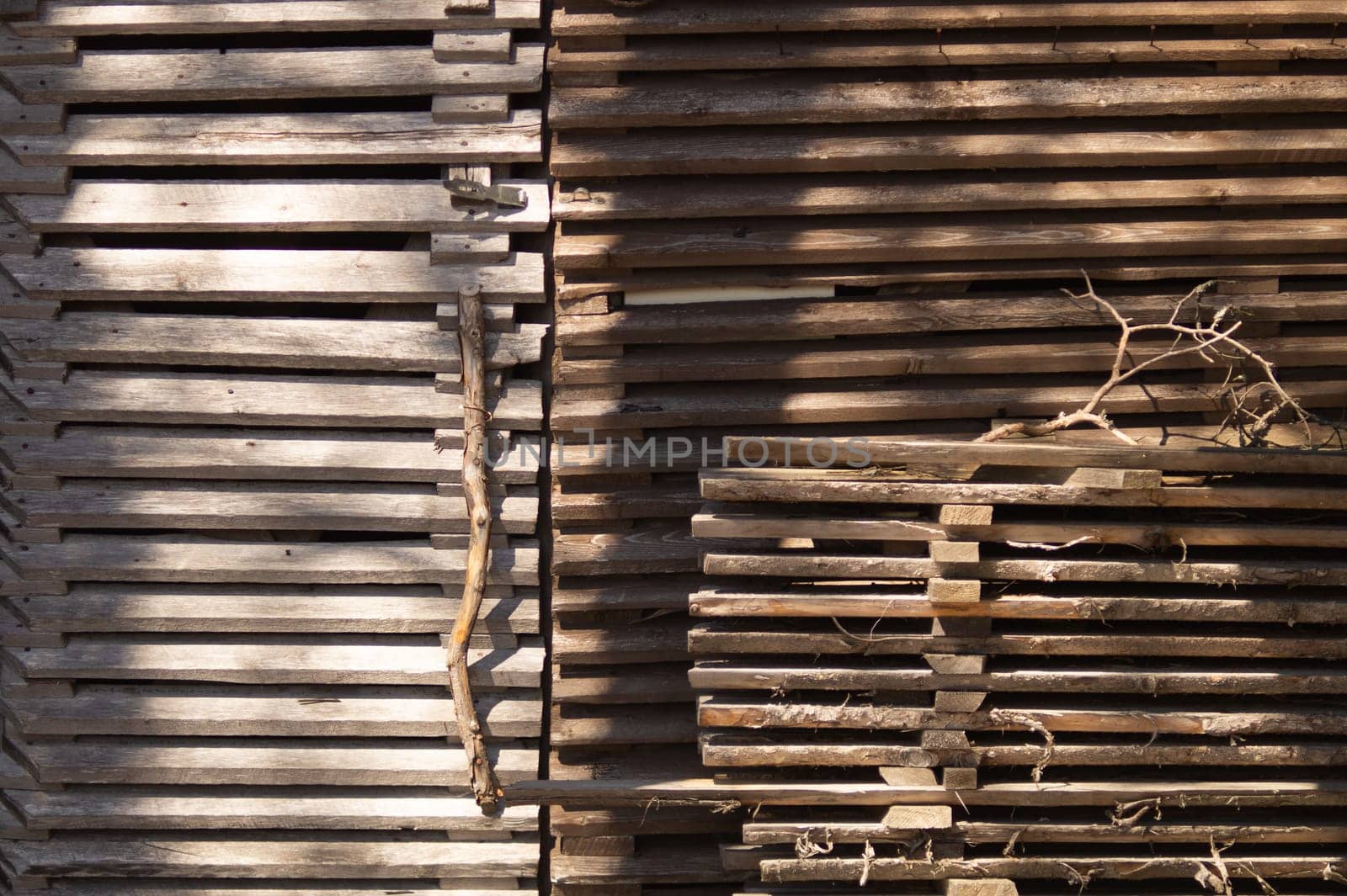 Handcrafted wooden door. plank wall of wooden house