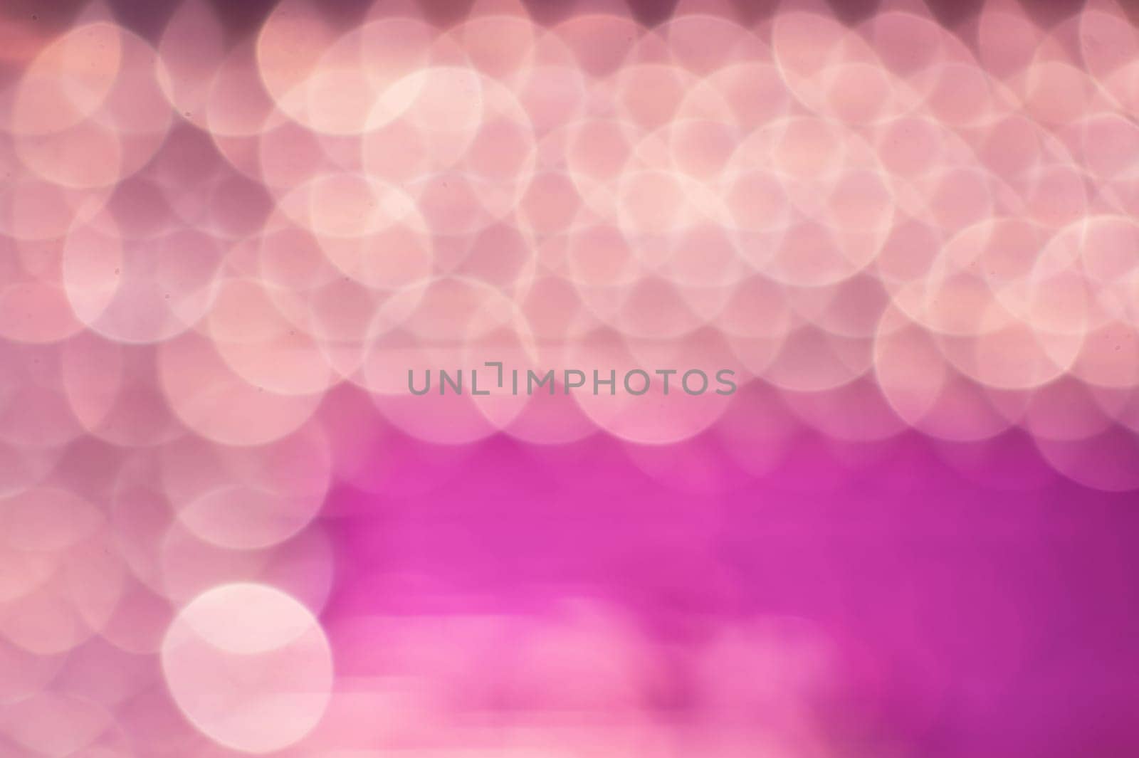 Abstract colorful bokeh defocused lights in pattern of straight rows. holiday background