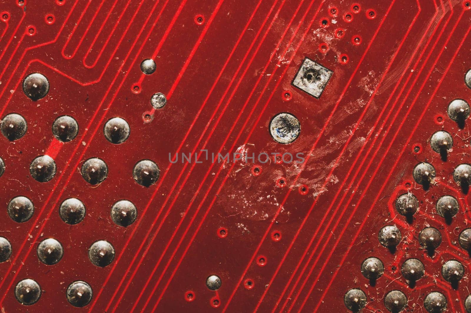 Spoiled motherboard close up. circuit board with dust and defects. modern technologies. micro elements of computer with connections and traces. Intelligent technology abstract background