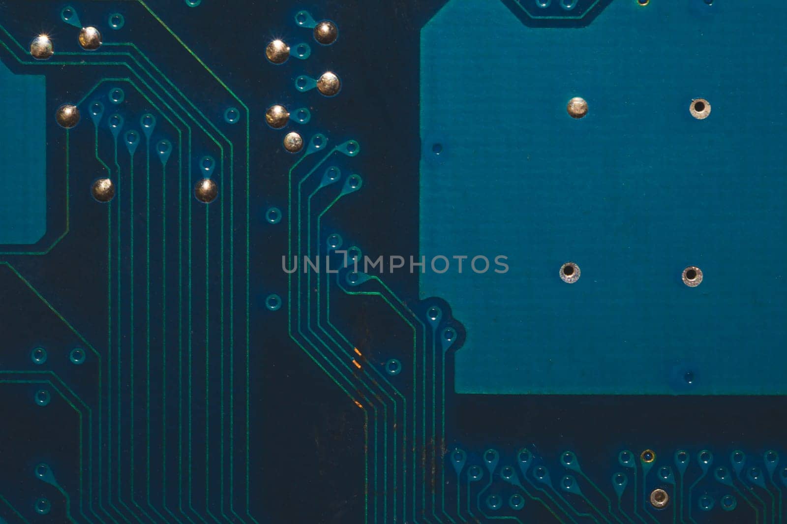 Dusty circuit board. computer motherboard close up. modern technologies. micro elements of computer with connections and traces. Intelligent technology abstract background