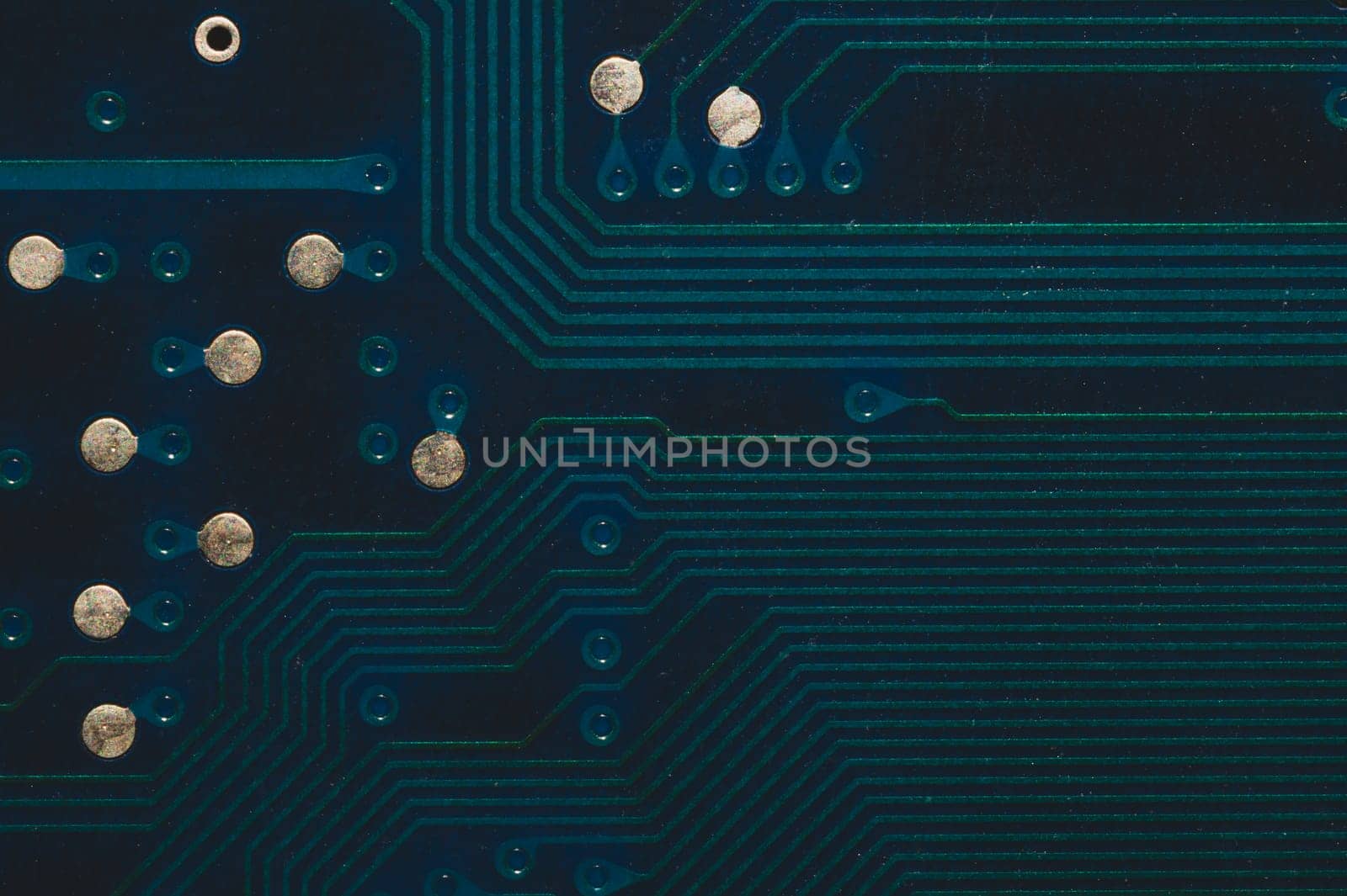 Dusty circuit board. computer motherboard close up. modern technologies. micro elements of computer with connections and traces. Intelligent technology abstract background