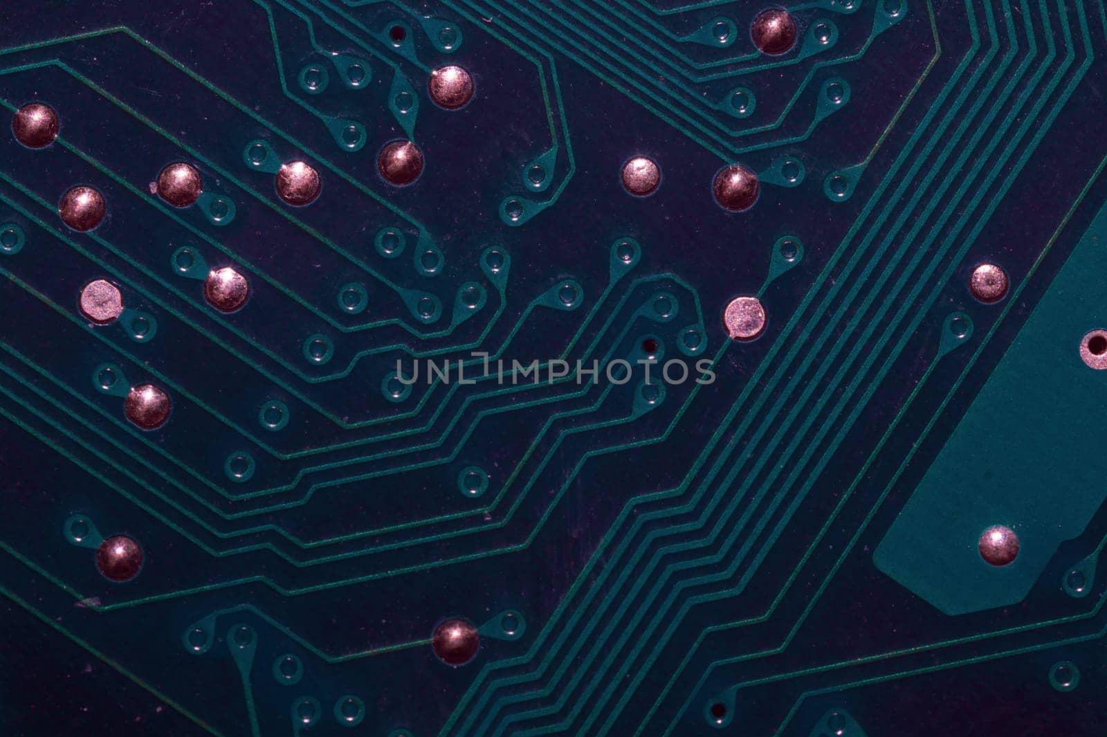 Dusty circuit board. computer motherboard close up. modern technologies. micro elements of computer with connections and traces. Intelligent technology abstract background