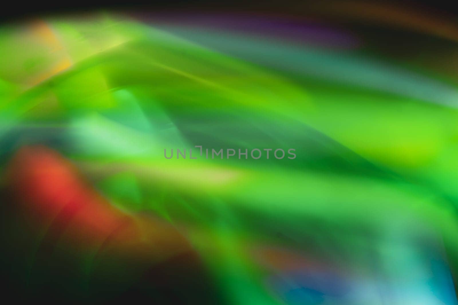Colorful light traces with long exposure in the dark. abstract blurred lights background