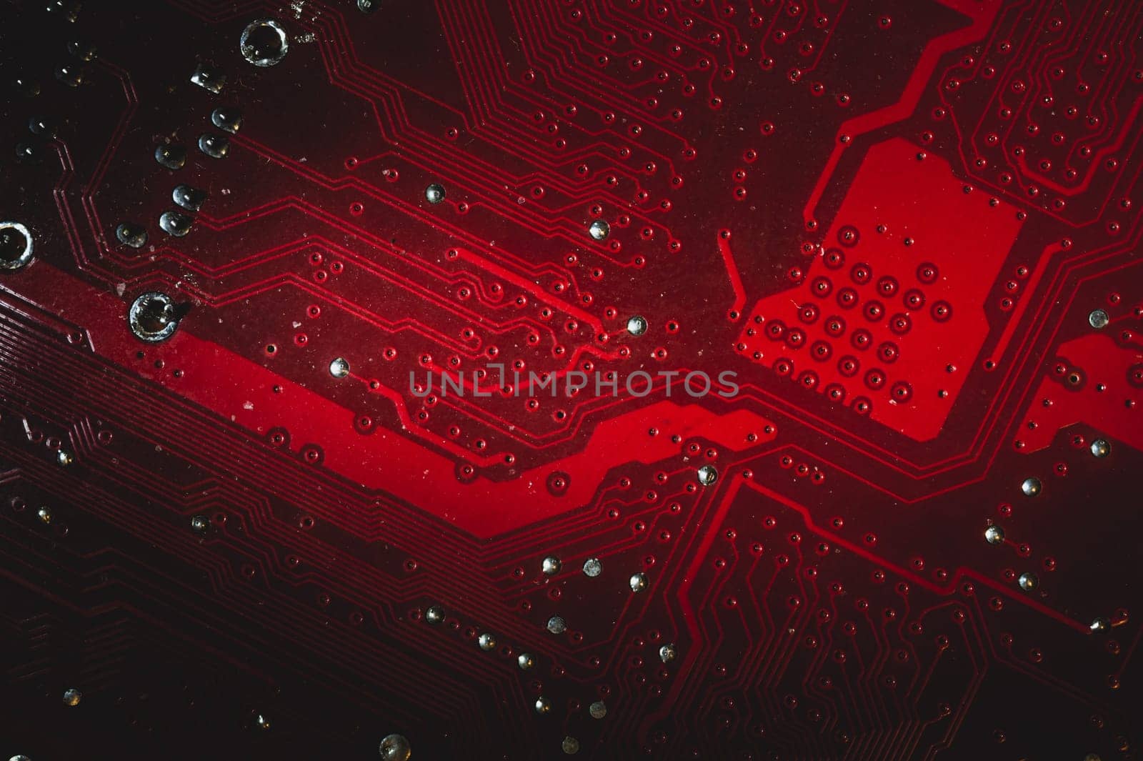 Dusty motherboard close up. circuit board with dust and defects. modern technologies. micro elements of computer with connections and traces. Intelligent technology abstract background