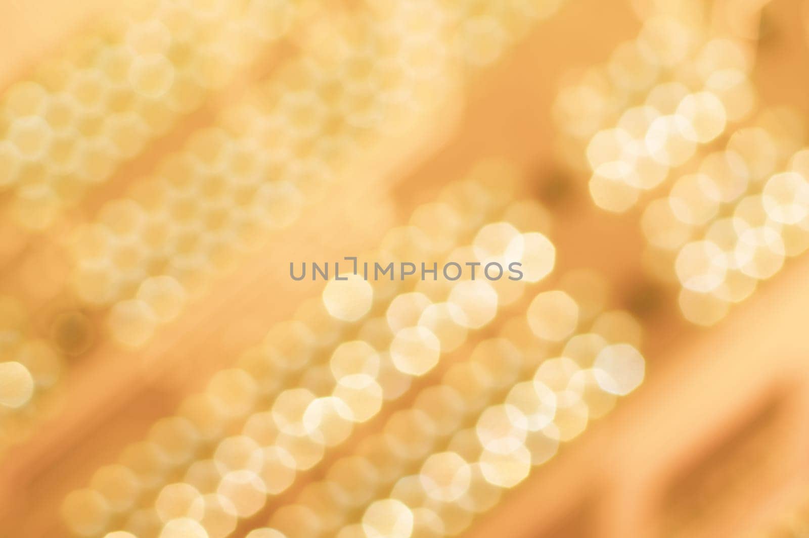 Abstract colorful bokeh defocused lights in pattern of straight rows. holiday background
