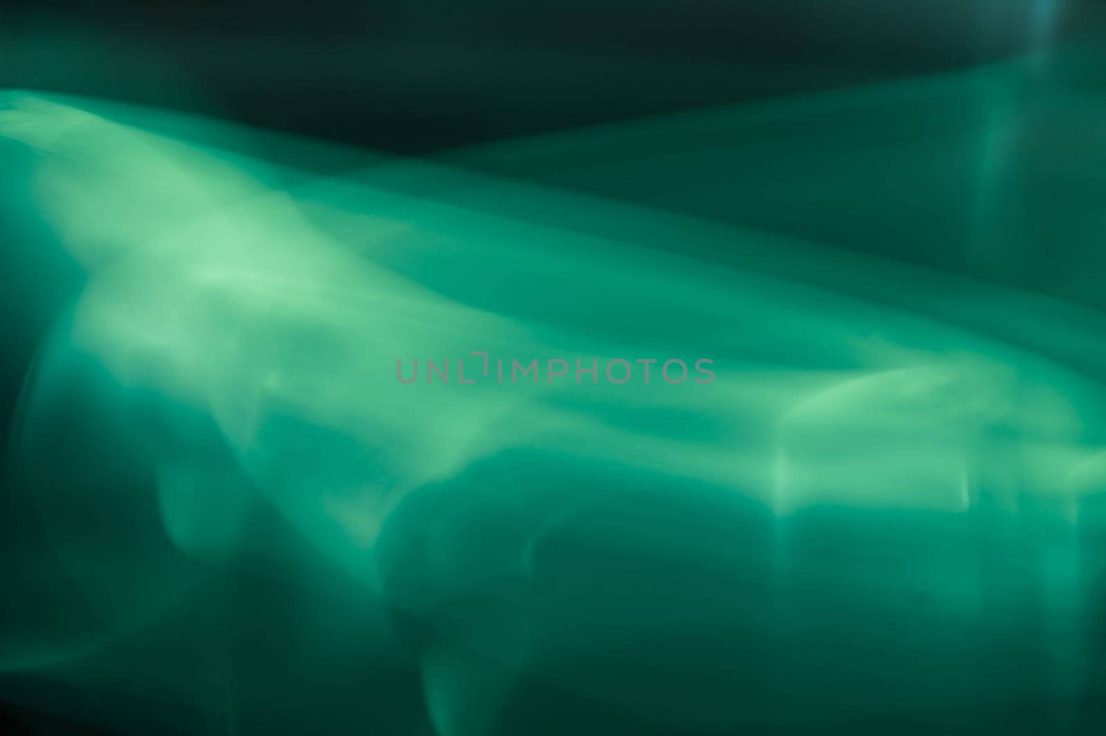 Colorful light traces with long exposure in the dark. abstract blurred lights background