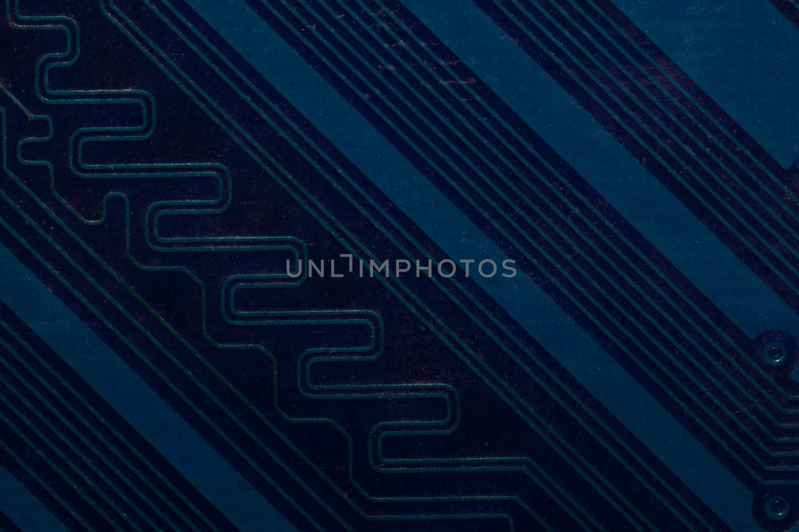 Dusty circuit board. computer motherboard close up. modern technologies. micro elements of computer with connections and traces. Intelligent technology abstract background