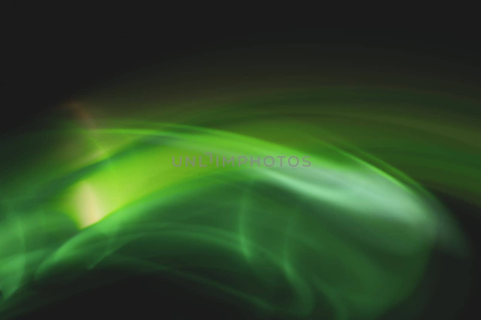 Colorful light traces with long exposure in the dark. abstract blurred lights background