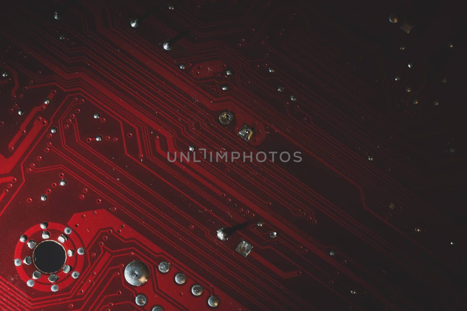 Dusty motherboard close up. circuit board with dust and defects. modern technologies. micro elements of computer with connections and traces. Intelligent technology abstract background