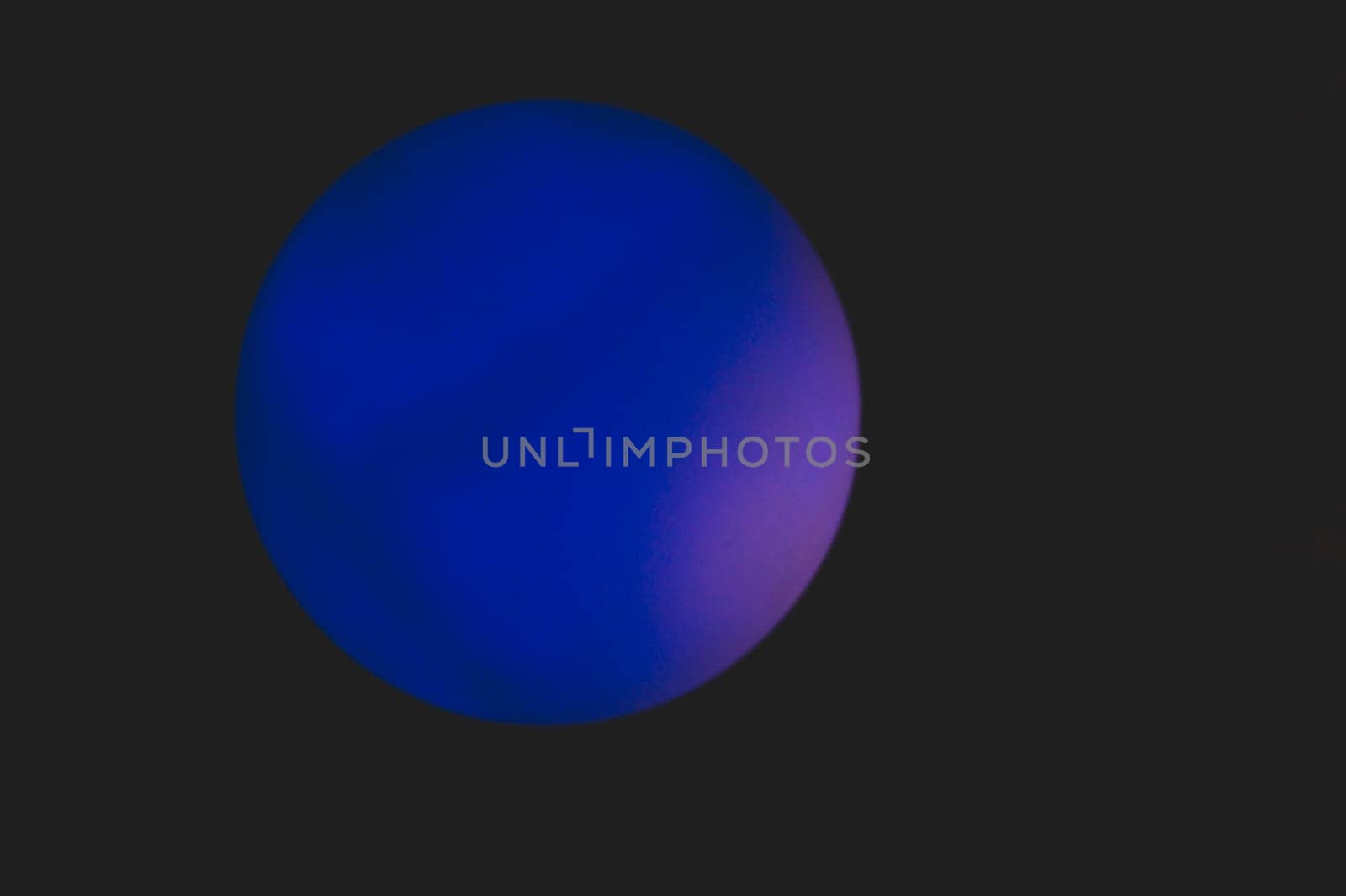 Glowing sphere in the dark. round template with color backlit
