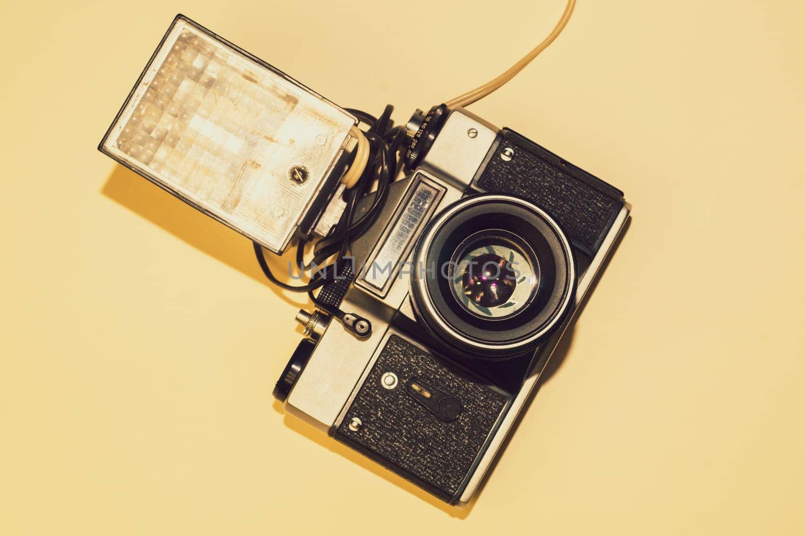 Vintage camera on yellow background. copy space