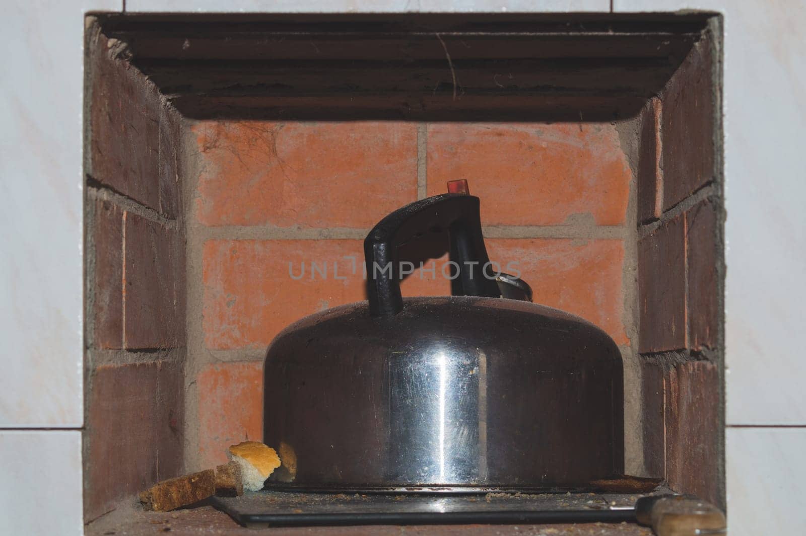 Old aluminium kettle. still life in rustic kitchen