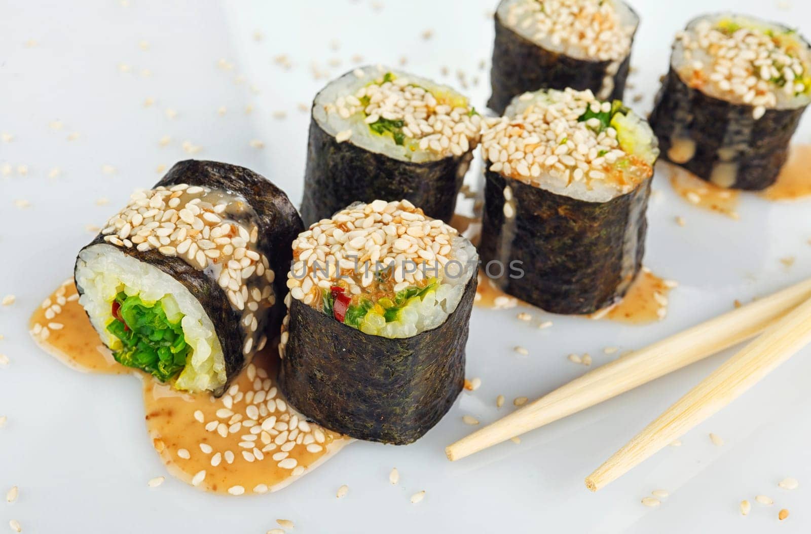 Traditional japanese sush with two Chopsticks isolated on white background