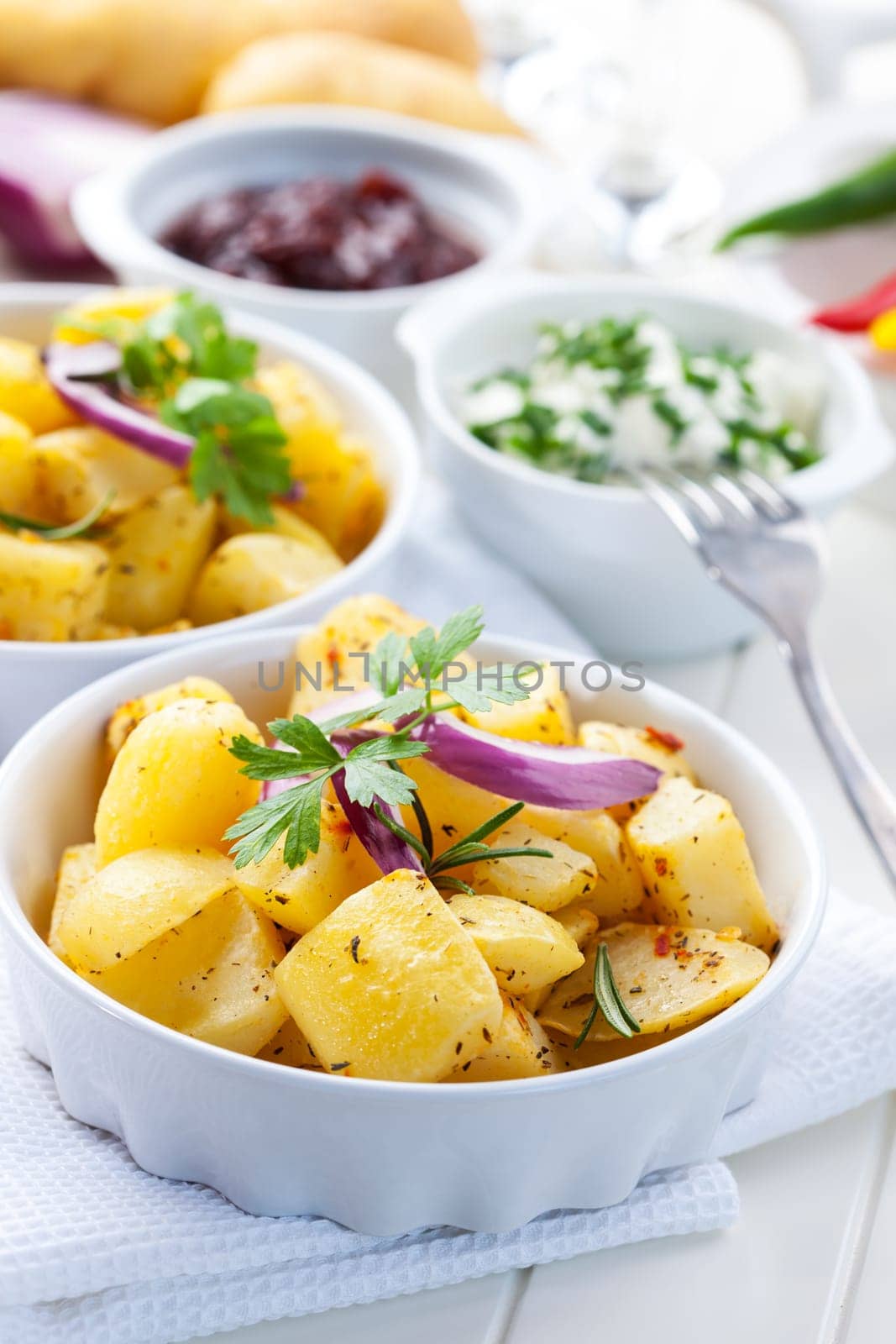 Baked potatoes with chutney and sour cream