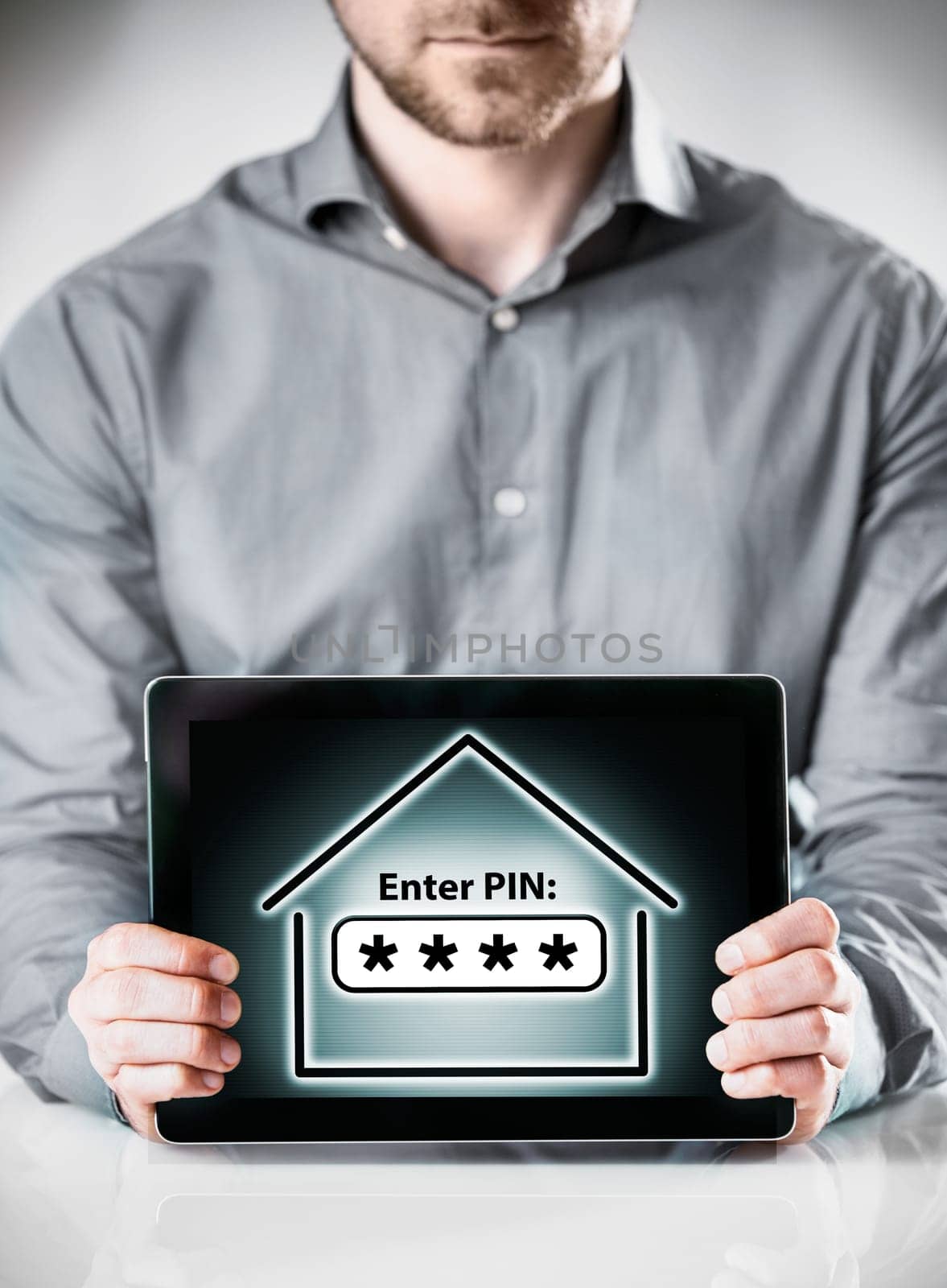Close up Man in Long Sleeves Shirt Holding Tablet Gadget Showing Conceptual Enter Pin Inside a Home Display on the Screen.