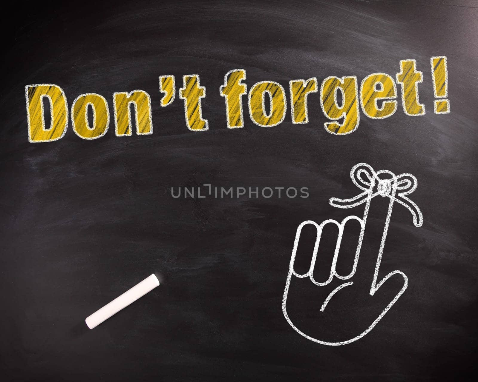 Conceptual Don't Forget Text in Yellow on Black Chalkboard with Hand Drawing Design.