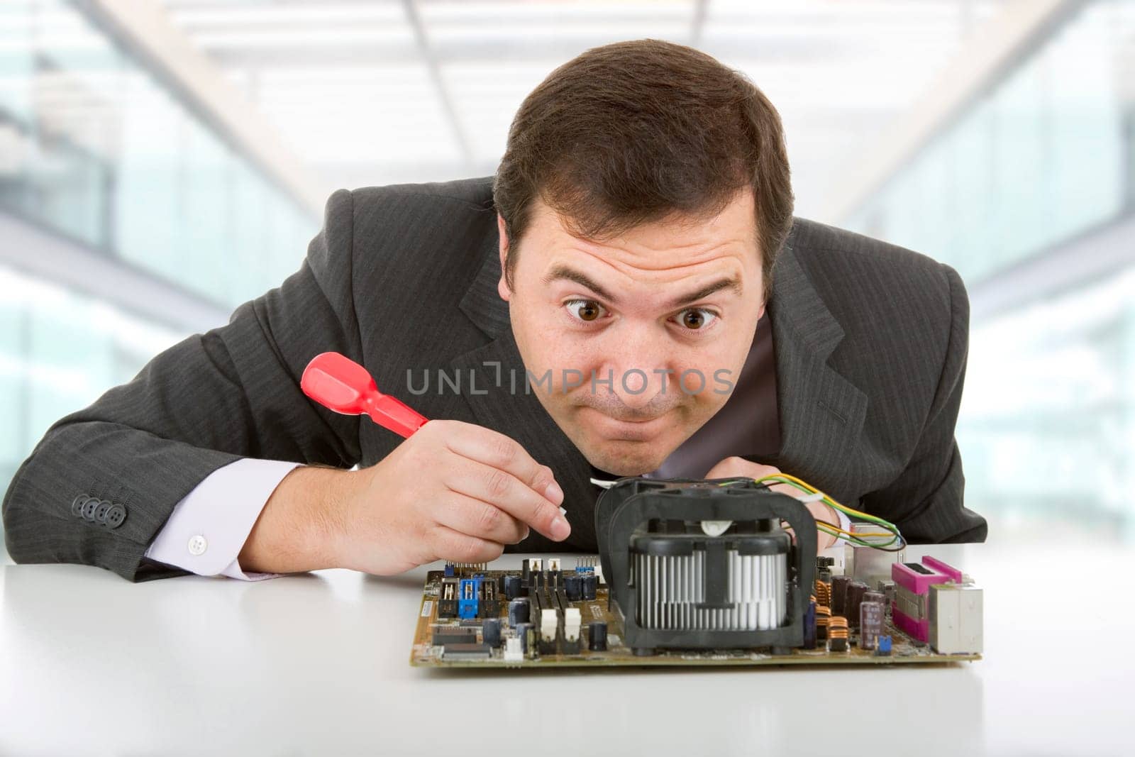 Computer Engineer working in a motherboard at the office