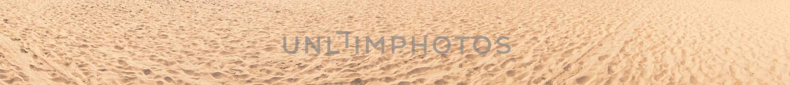 Sand on the beach wide and long panorama for banner