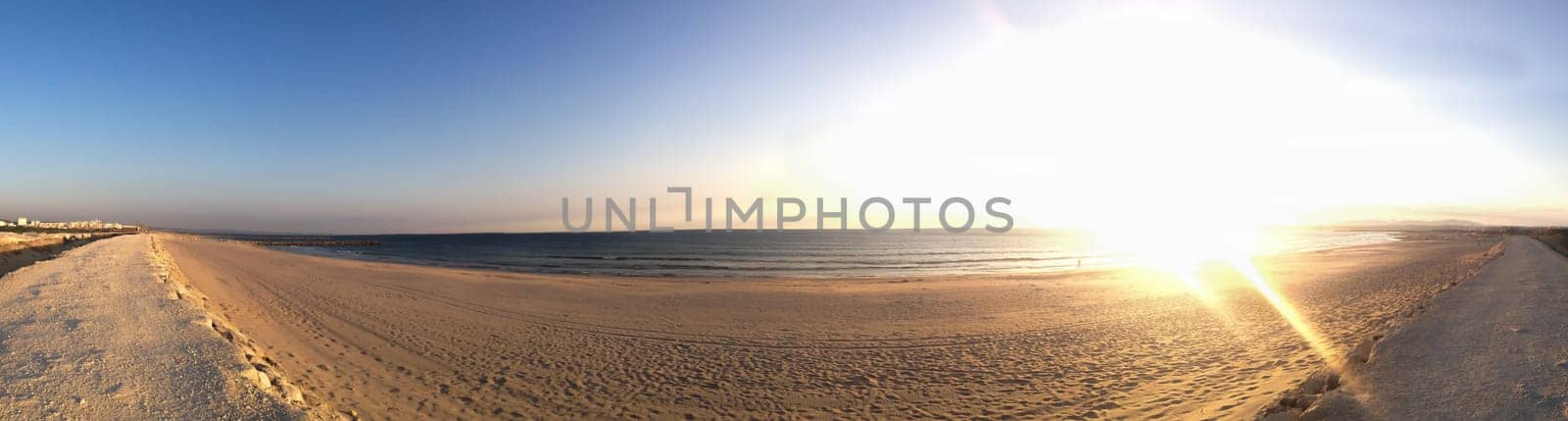 Atlantic ocean panorama with the sand beach. horizon line with the water and sky