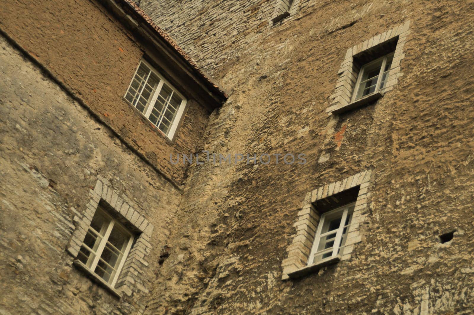 Old brown brick wall with windows background