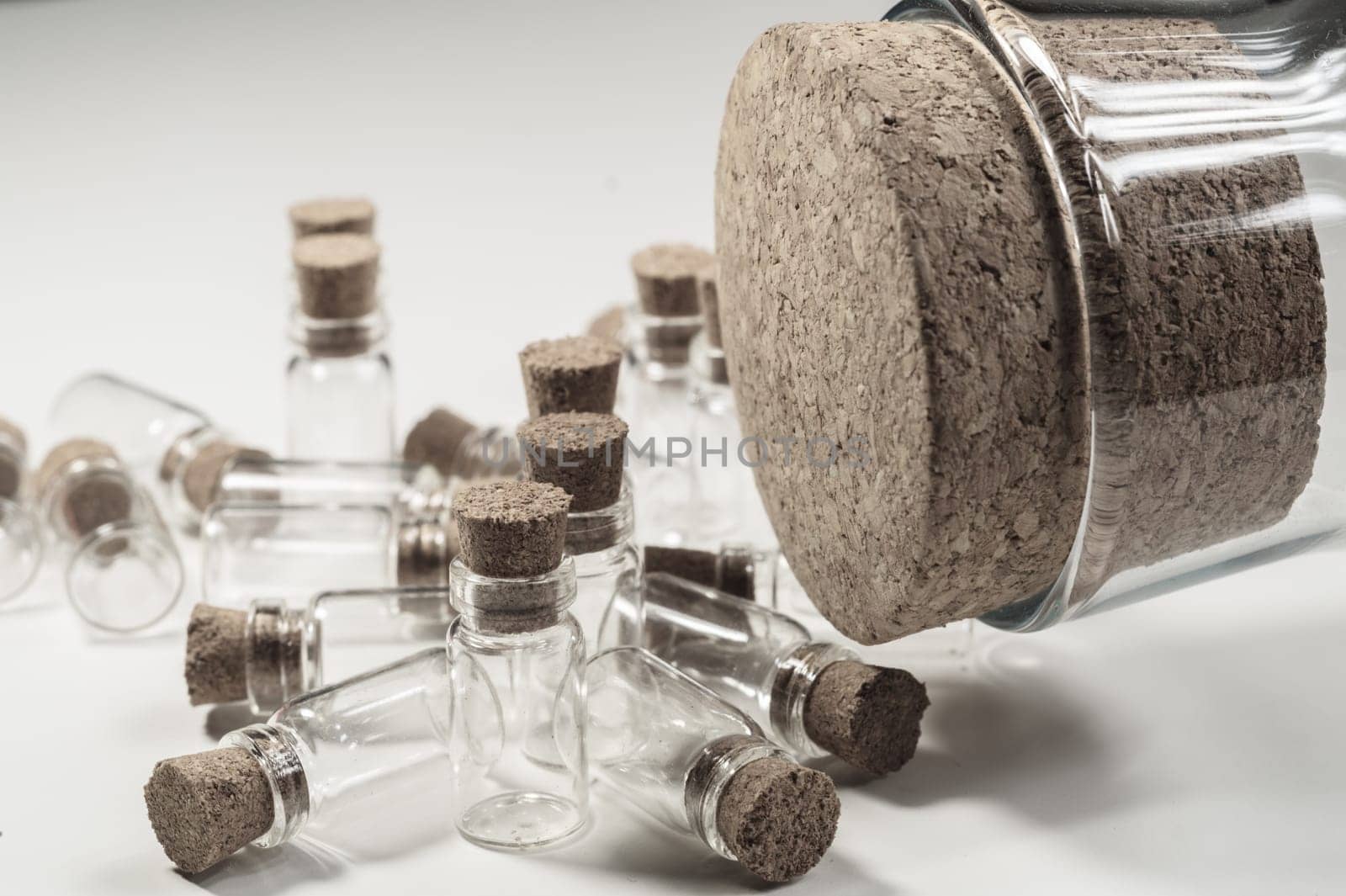 Little bottles with cork stopper isolated on white. big bottle with cork. glass vessels. transparent containers. test tubes