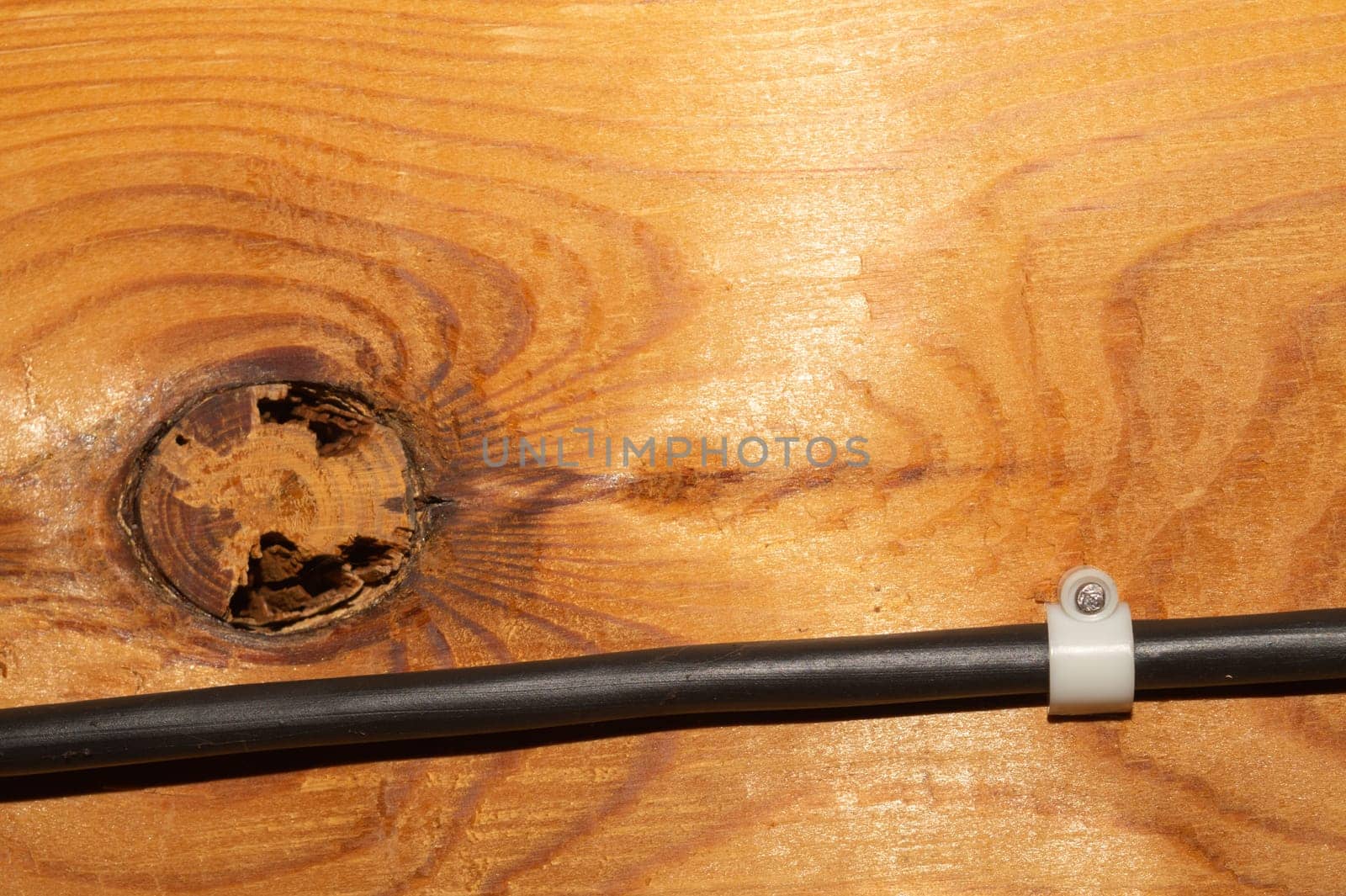 Old wood background. wooden texture with a cable