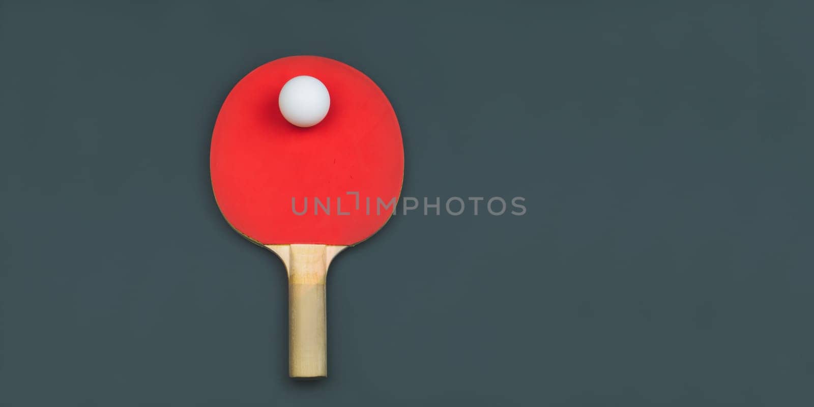 Red table tennis racket with a ball isolated on a colored background. sport equipment for ping pong. copy space