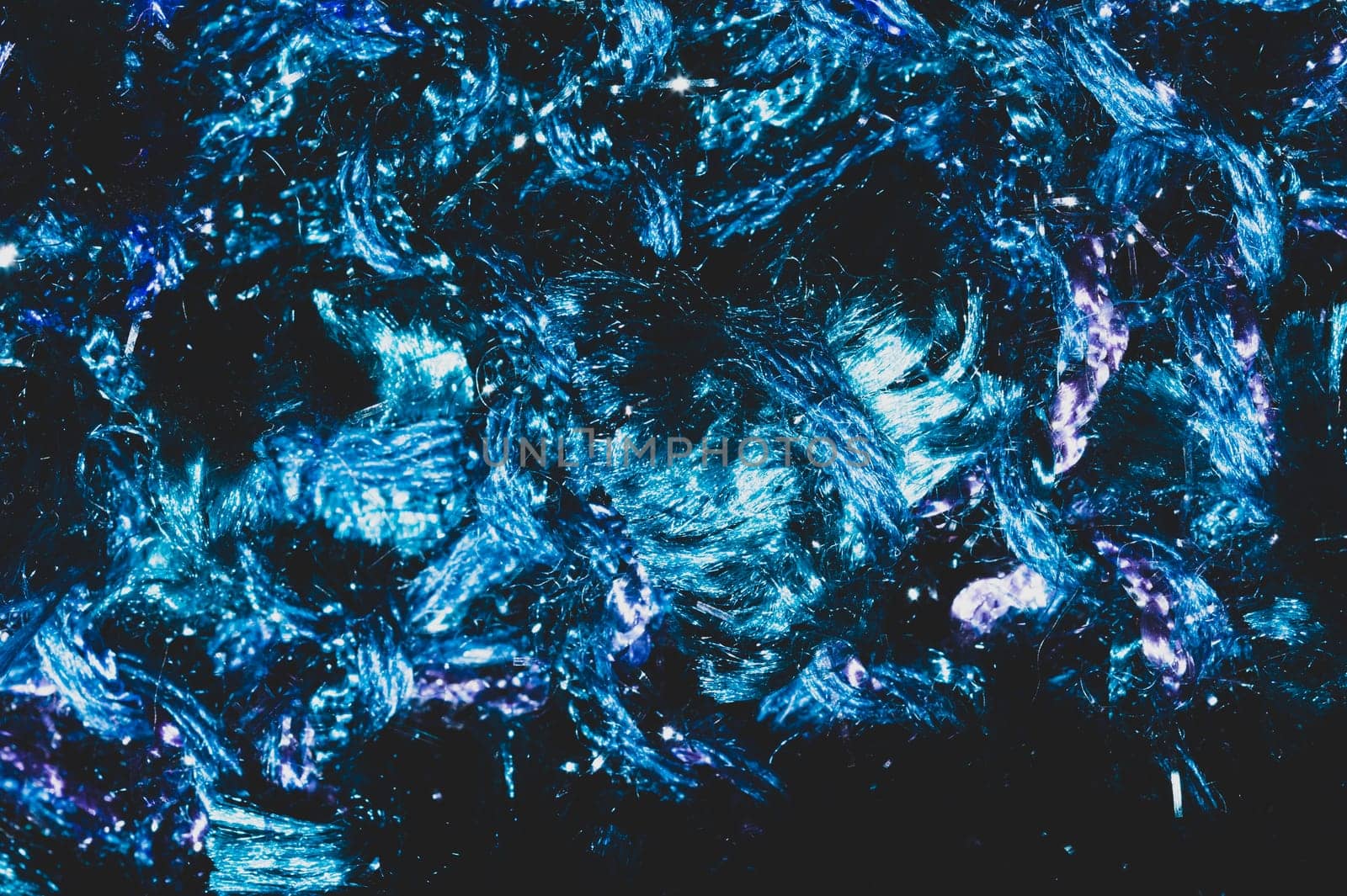 Soft fabric texture. blue textile with curly fibers. wool background close up