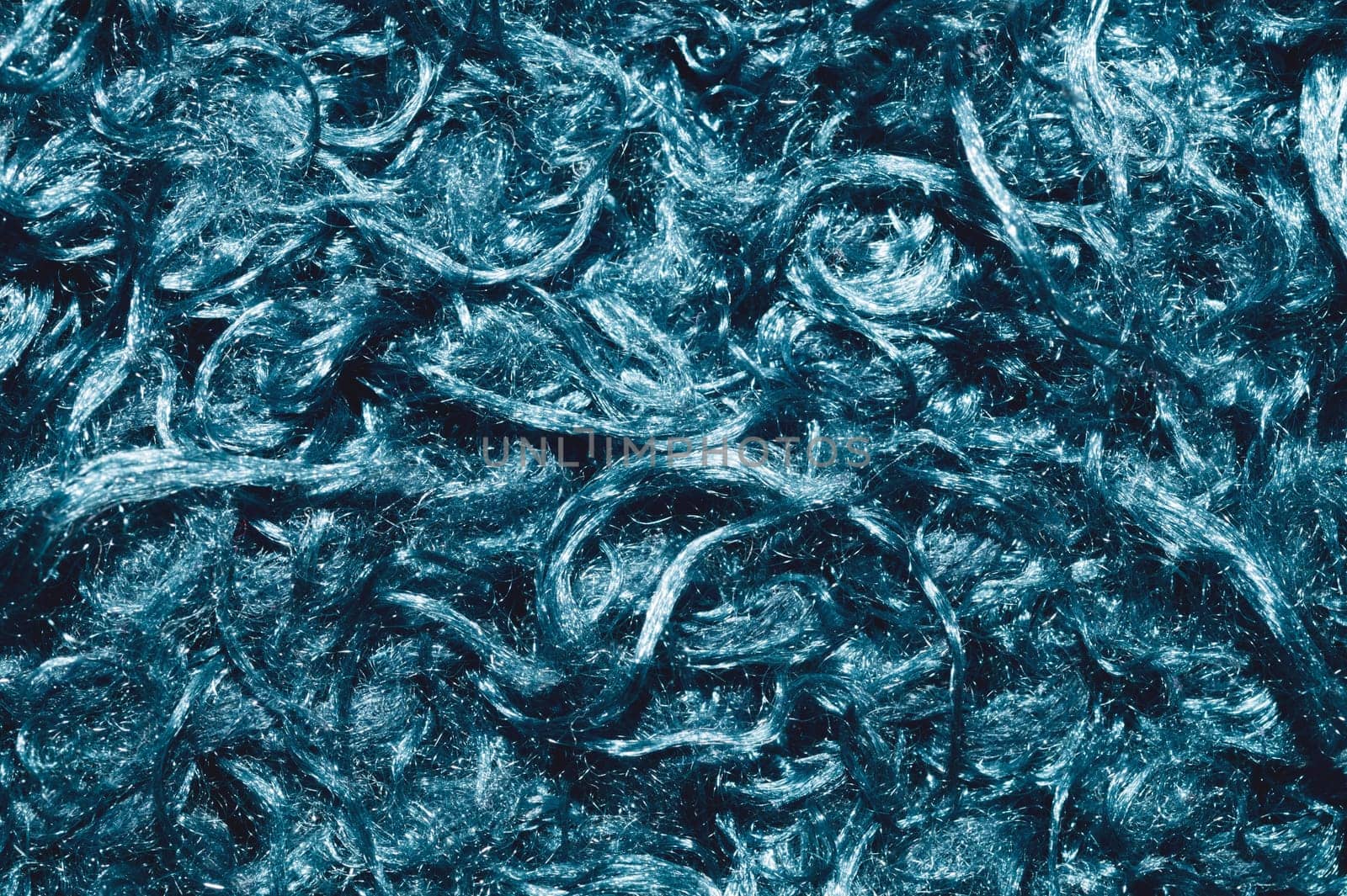 Soft fabric texture. turquoise extile with curly fibers. wool background close up