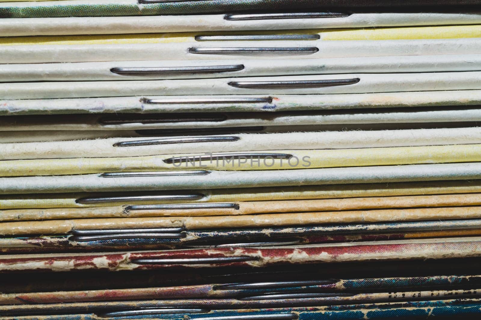 Stack of old magazines. pile of retro newspapers. vintage journals lie on top of each other