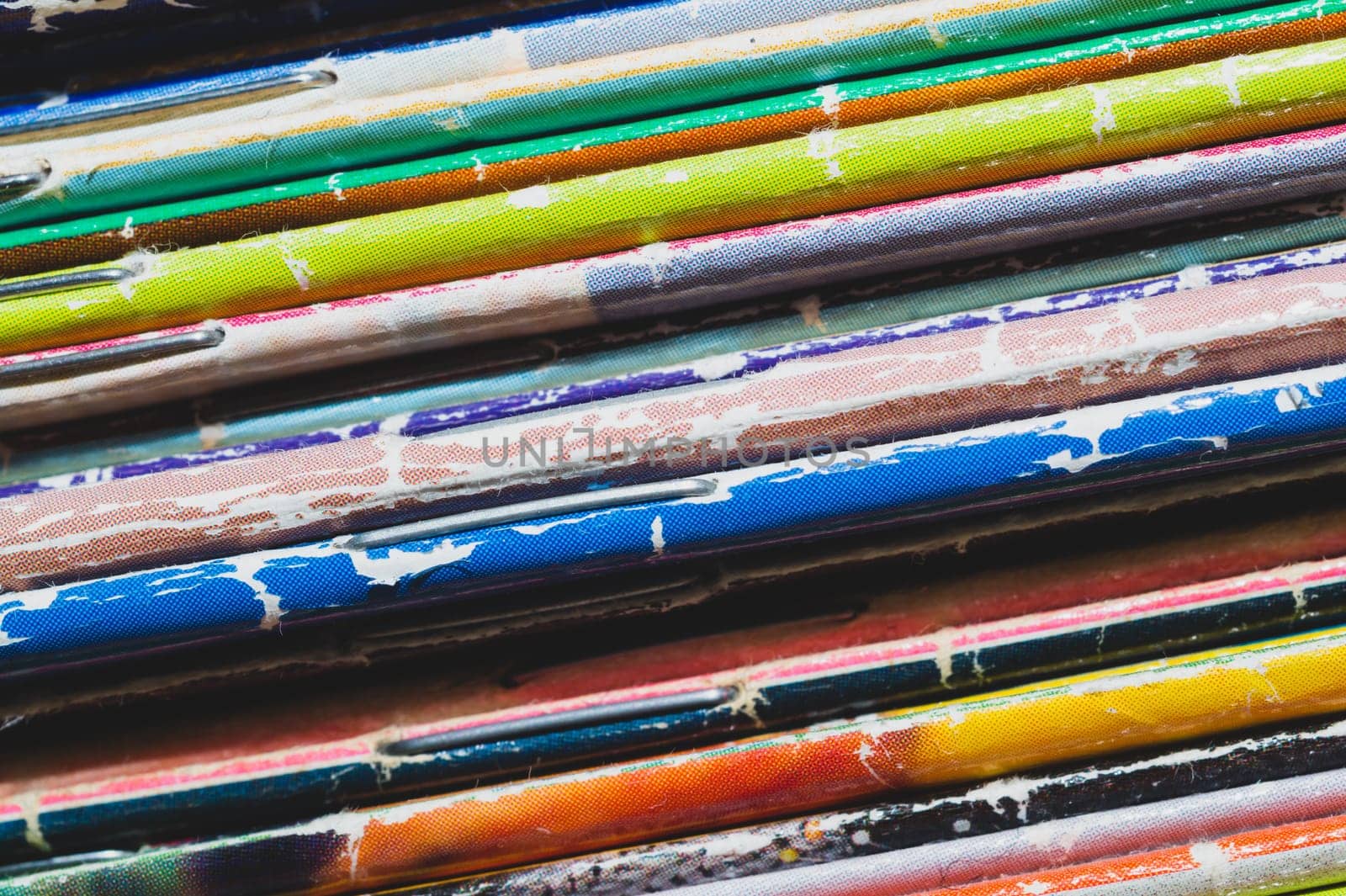Stack of old magazines. pile of retro newspapers. vintage journals lie on top of each other. colorful background from the printed publications