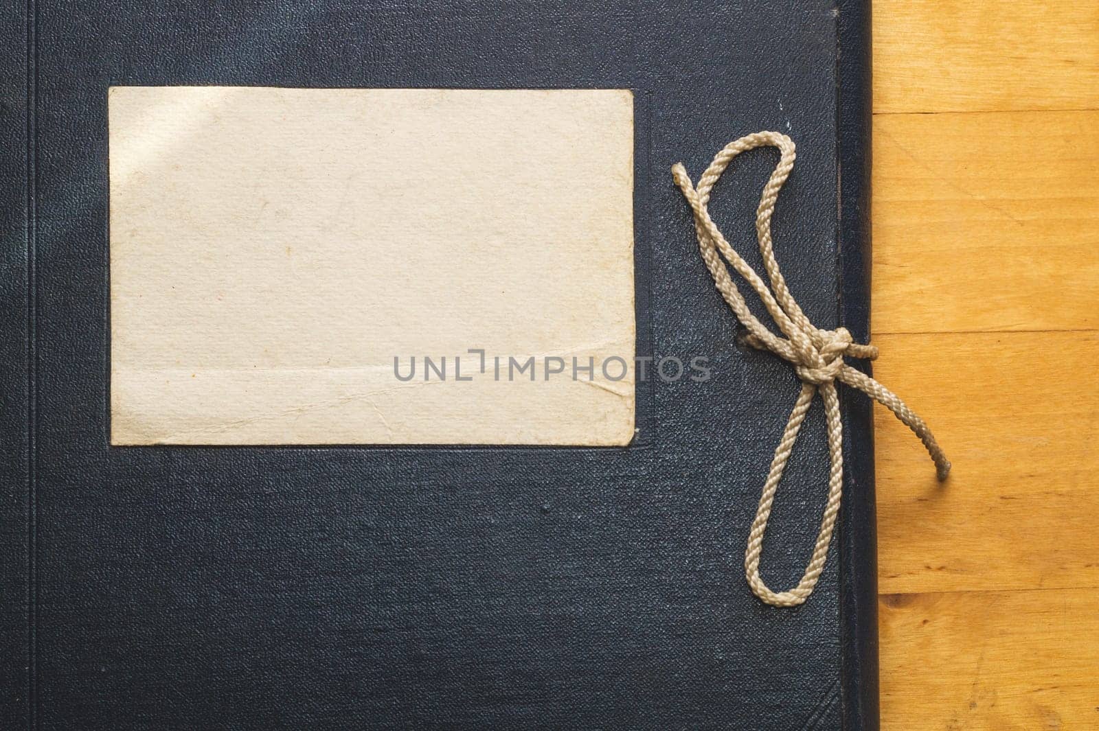 Vintage folder for paper with blank label. old folder for documents lies on a wooden table. copy space