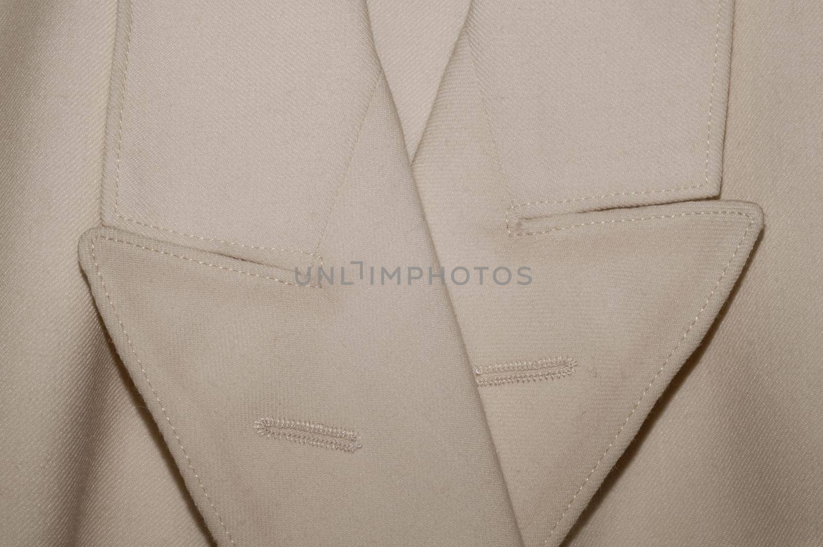 Vintage jacket detail. old suit close up. beige clothes