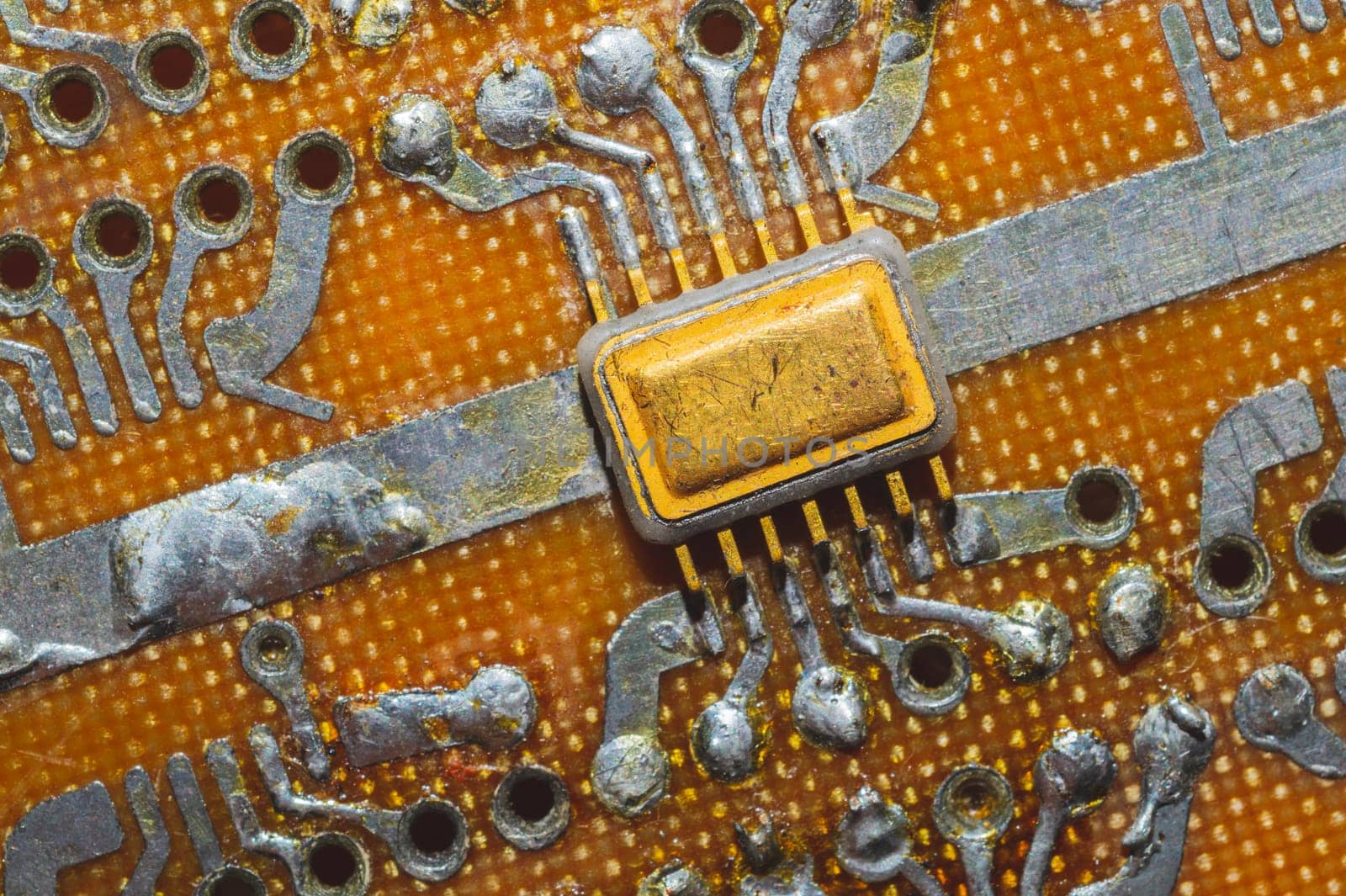 Handmade circuit board with microchip. integrated scheme. industrial background. tracks on textolite