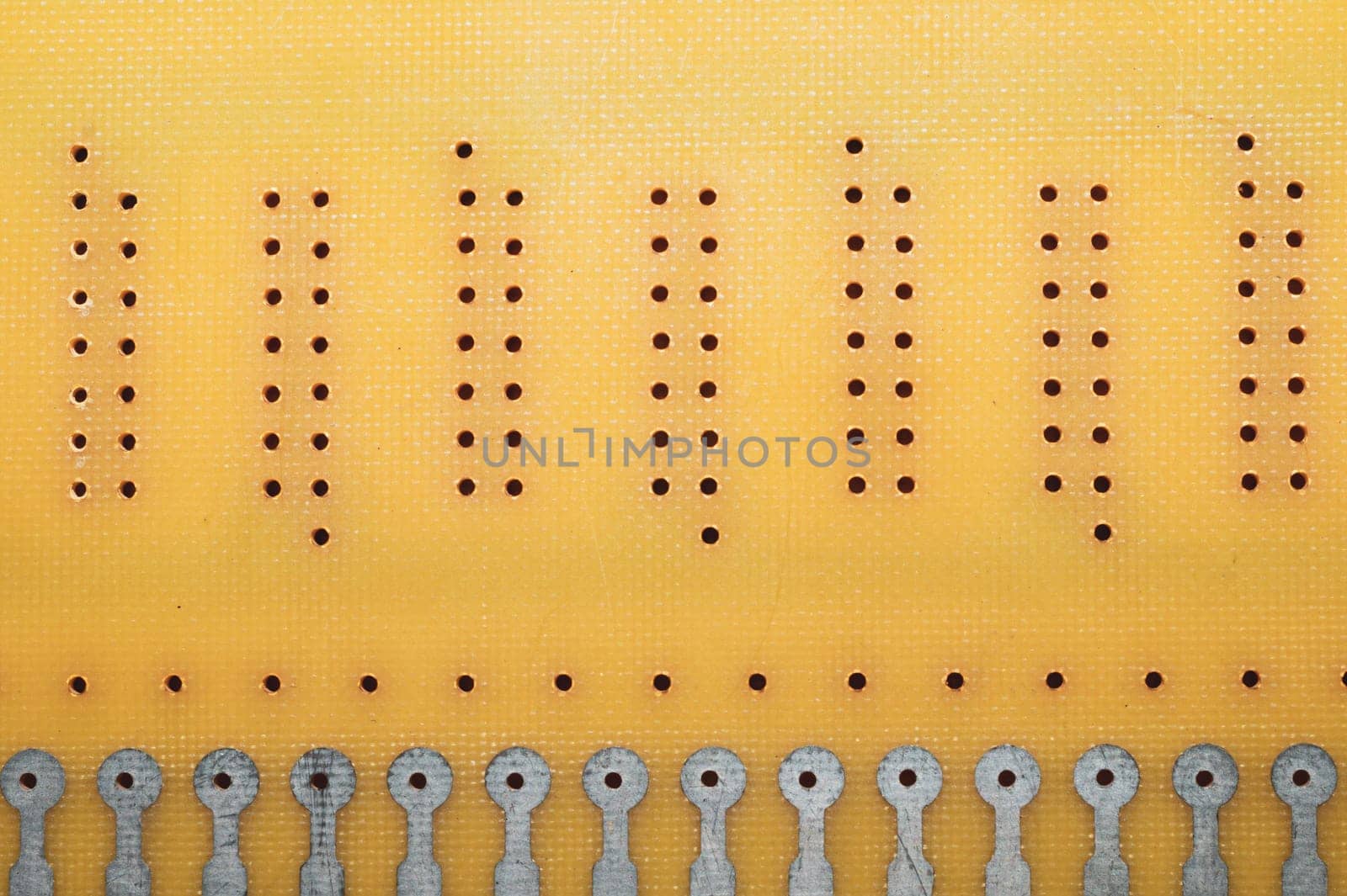 Dotted textolite surface. template for soldering the circuit. perforated background