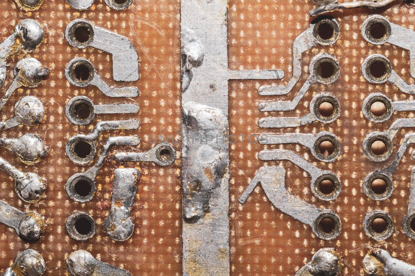 Handmade circuit board. industrial background. textolite with soldered tracks