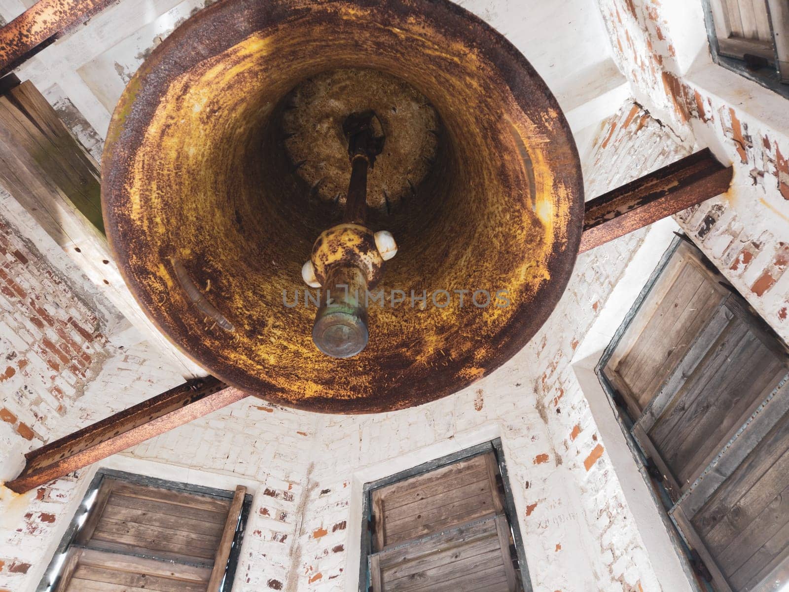 Old church bell. inside the ancient bell tower. abandoned belfry