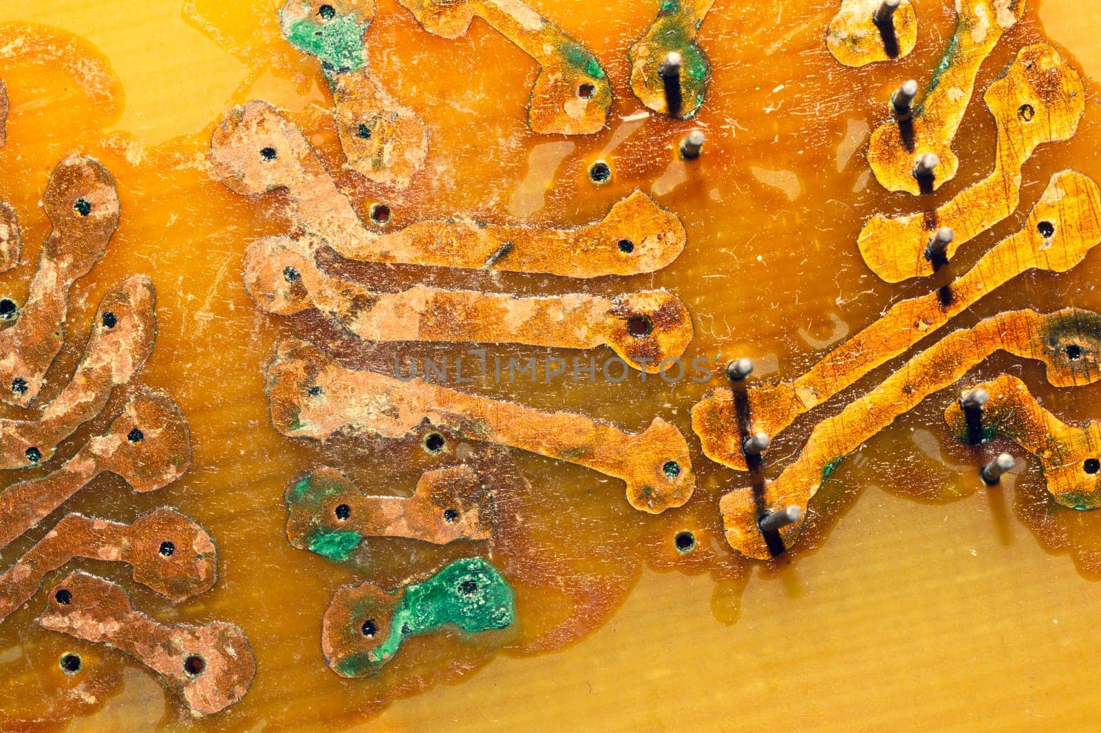 Handmade circuit board with copper tracks. industrial background. radio engineering background. textolite with soldering
