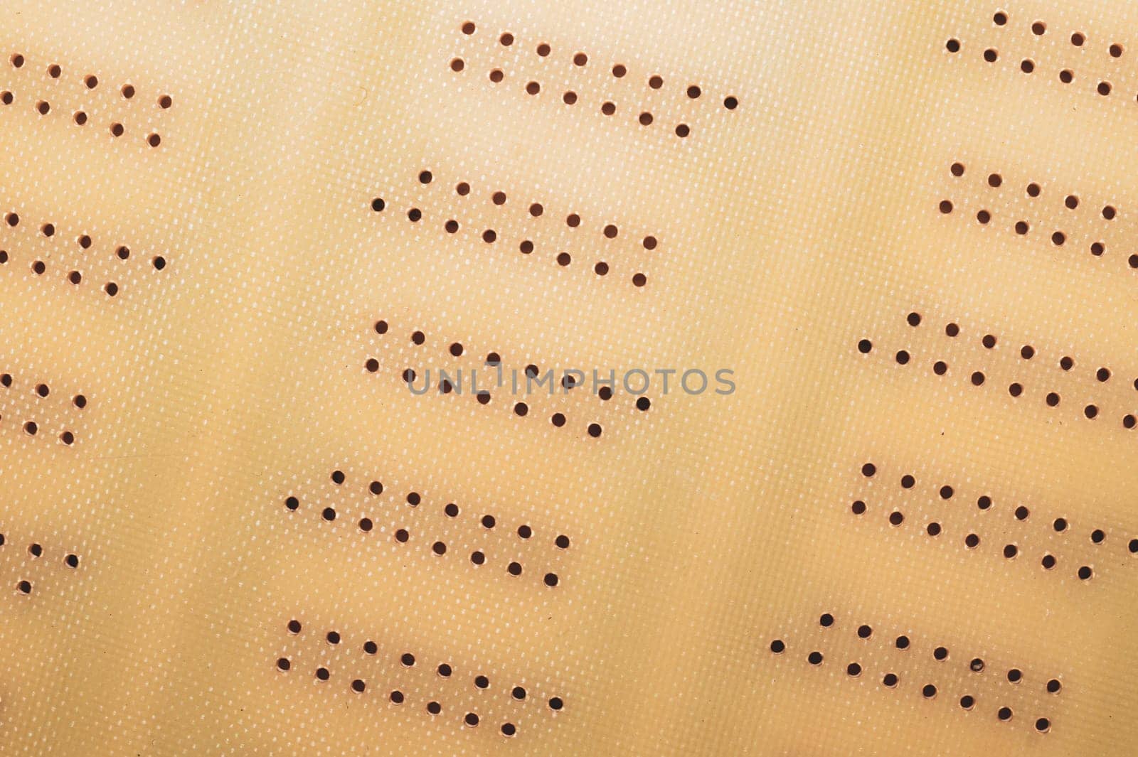 Dotted textolite surface. template for soldering the circuit. perforated background