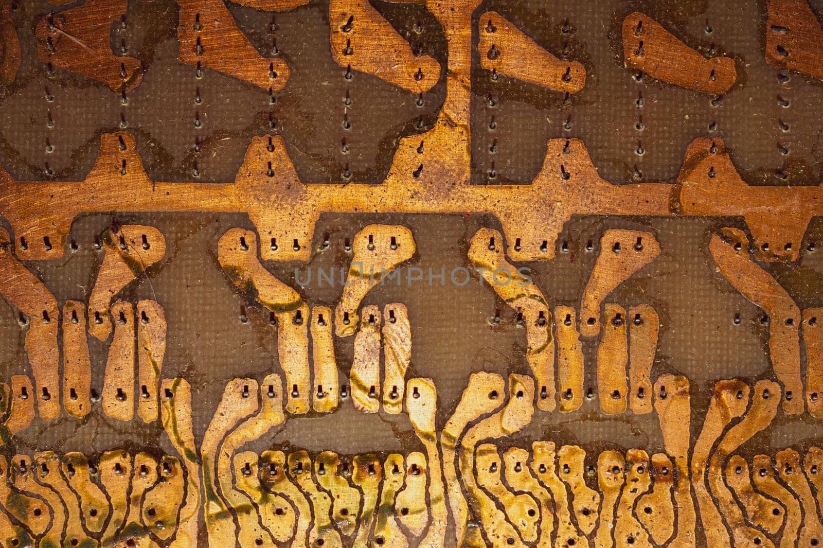 Handmade circuit board with soldered copper tracks. industrial background. textolite with soldering