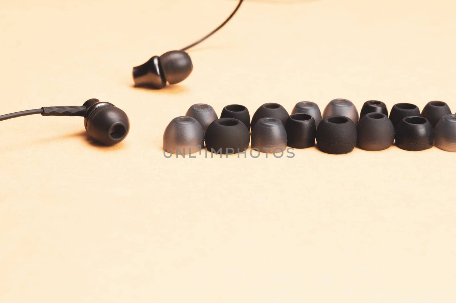 Earphones with row of ear cushions. in-ear headphones with many embouchures. audio equipment