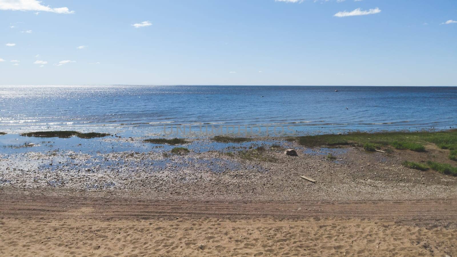 Shore of the sea. seascape with horizon line. silt coast. water surface