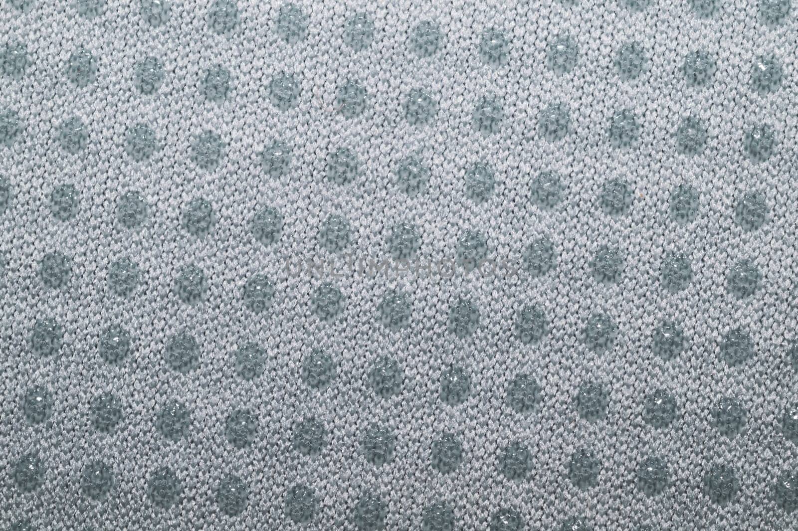 Fabric texture with dots close up. woven background. braided surface