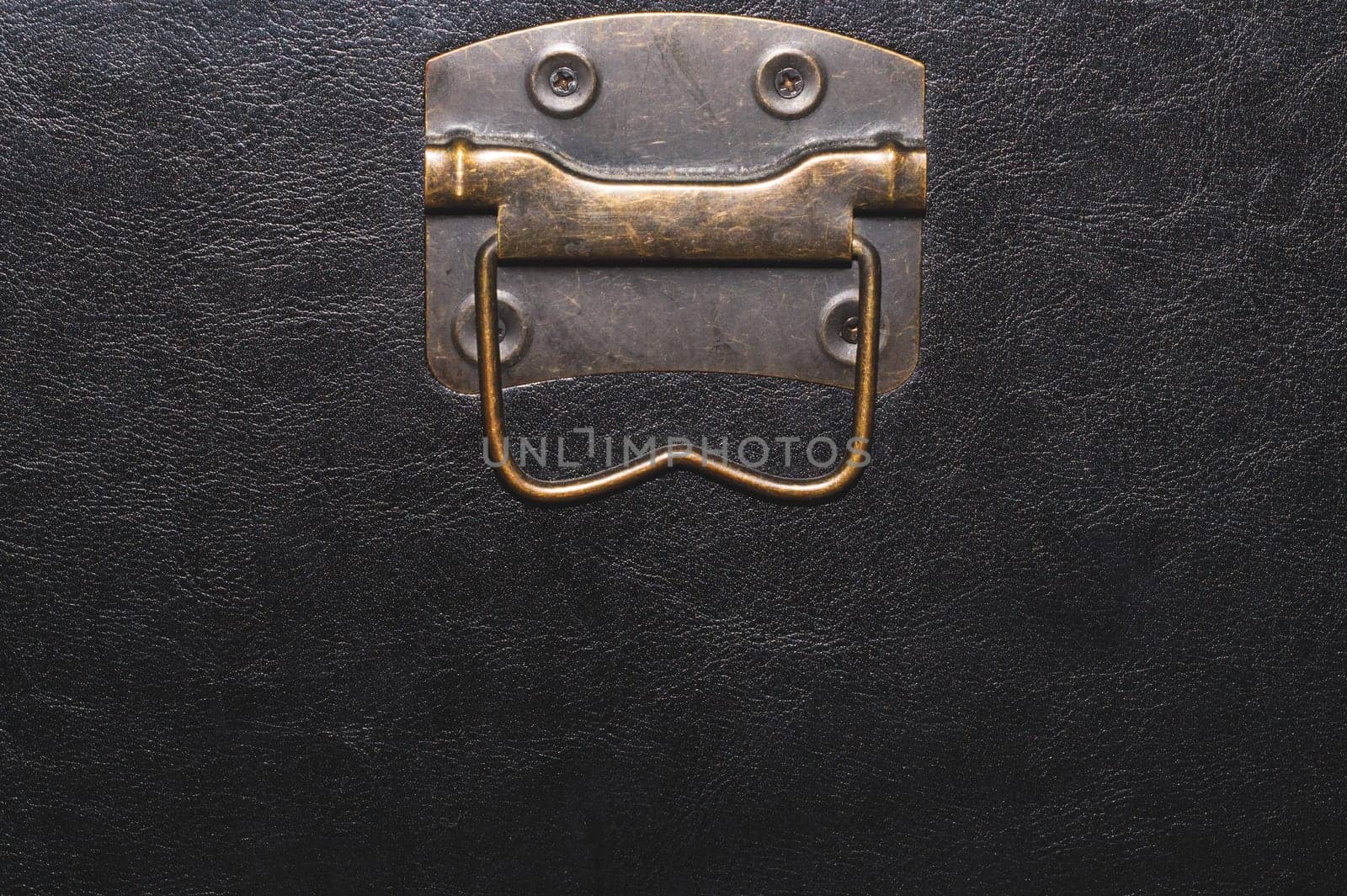 Metal handle with black leather background