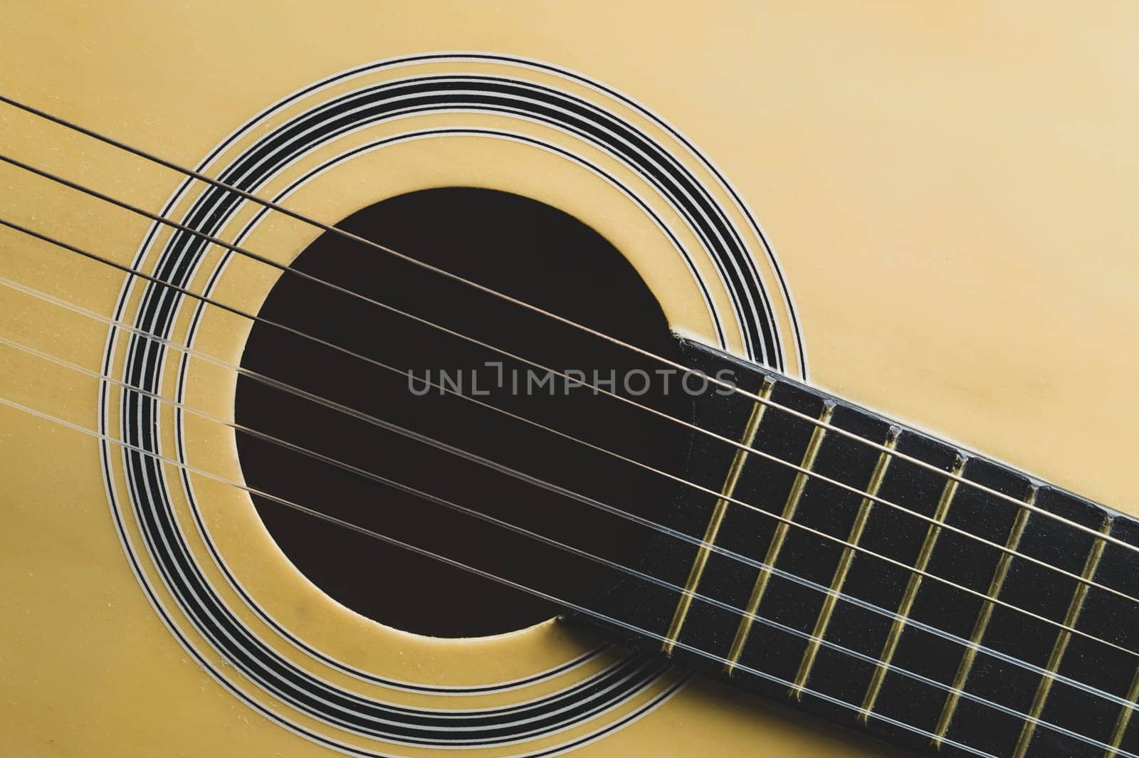 Acoustic guitar close up. musical instrument. strings on the guitar neck