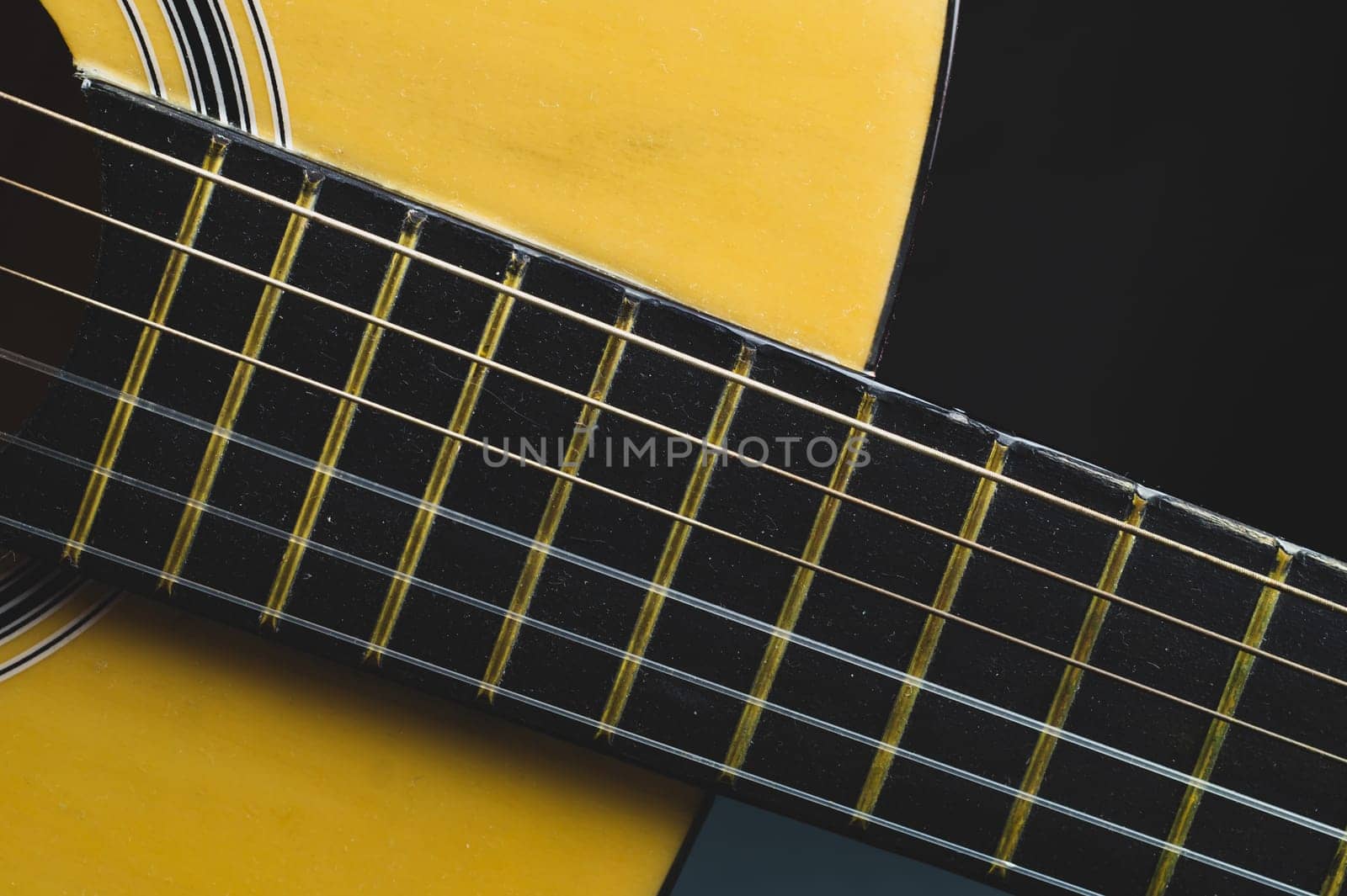 Acoustic guitar neck close up. guitar strings macro. musical instrument